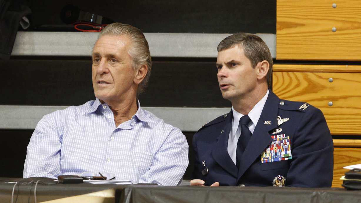 FILE - Miami Heat president Pat Riley, left, chats with Col. Michael T. Plehn as they watch Heat players during NBA basketball training camp, Tuesday, Sept. 28, 2010 in Hurlburt Field, Fla. AP Photo/Wilfredo Lee)