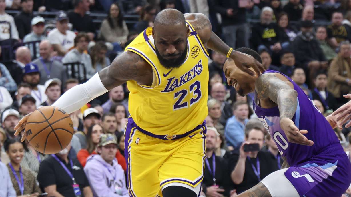 Los Angeles Lakers forward LeBron James (23) drives against Utah Jazz forward John Collins (20) during the first half of an NBA basketball game, Wednesday, Feb. 12, 2025, in Salt Lake City.