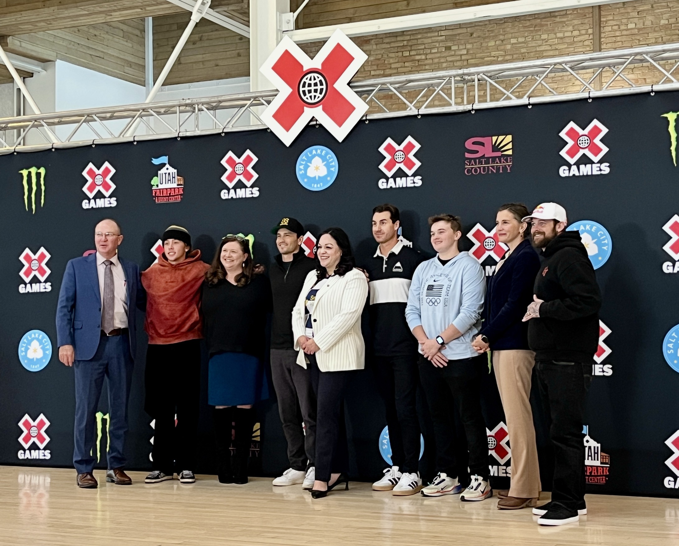 X Games executives and athletes pose for a photo with local and state leaders after announcing X Games will come to Salt Lake City in June during a press conference at the Utah State Fairpark on Thursday.