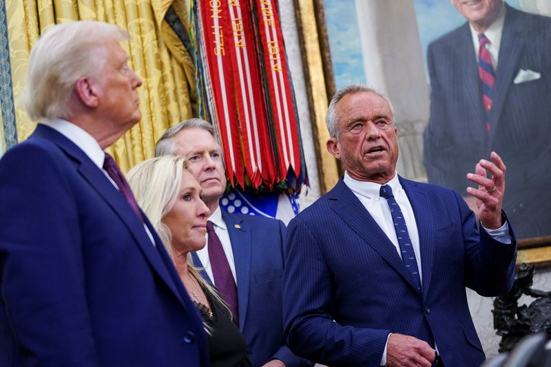 Robert F. Kennedy Jr. speaks in the Oval Office of the White House next to President Donald Trump and Rep. Marjorie Taylor Greene, R-Ga., on the day Kennedy is sworn in as secretary of Health and Human Service in Washington, Thursday.