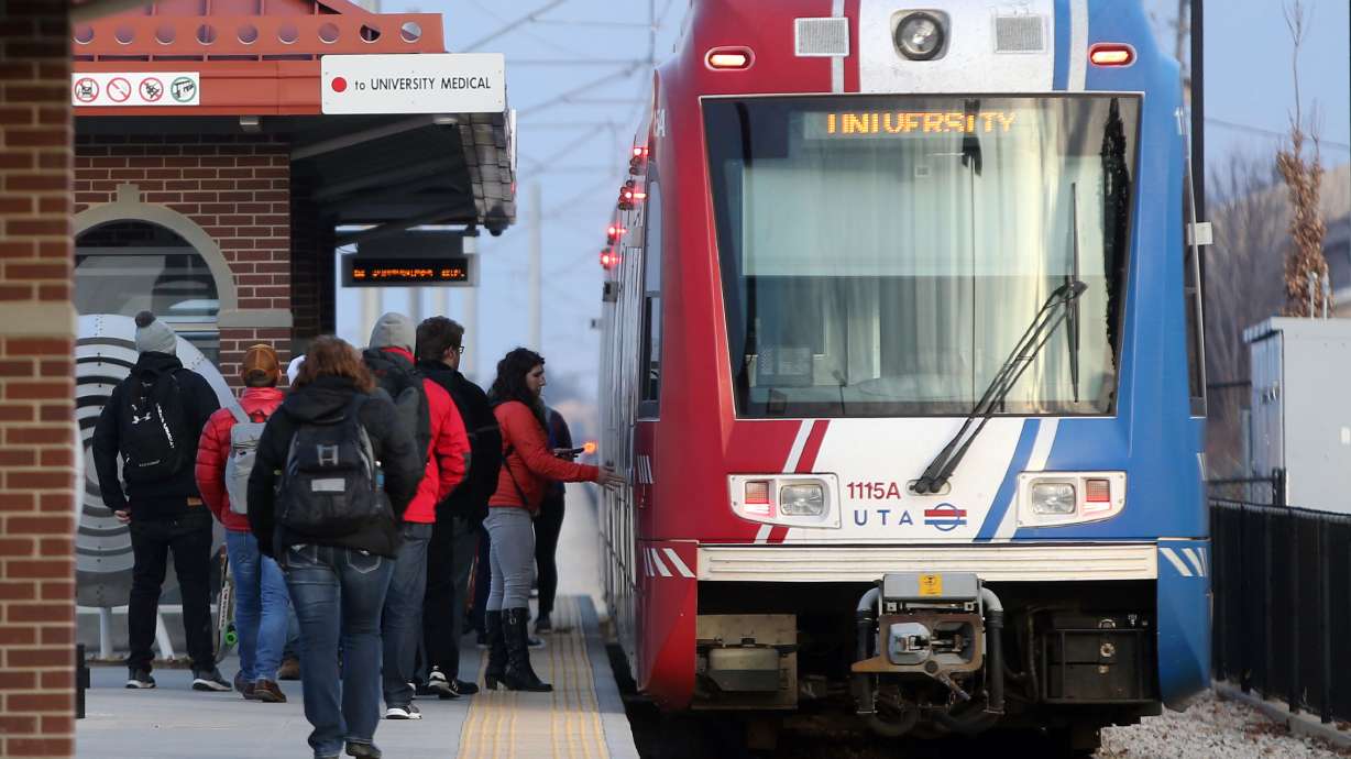 People board a Red Line train at the Bingham Junction TRAX Station in Midvale on Jan. 5, 2018. Utah Transit Authority is turning a Red Line car into "The Love Train," with live music and giveaways this weekend.