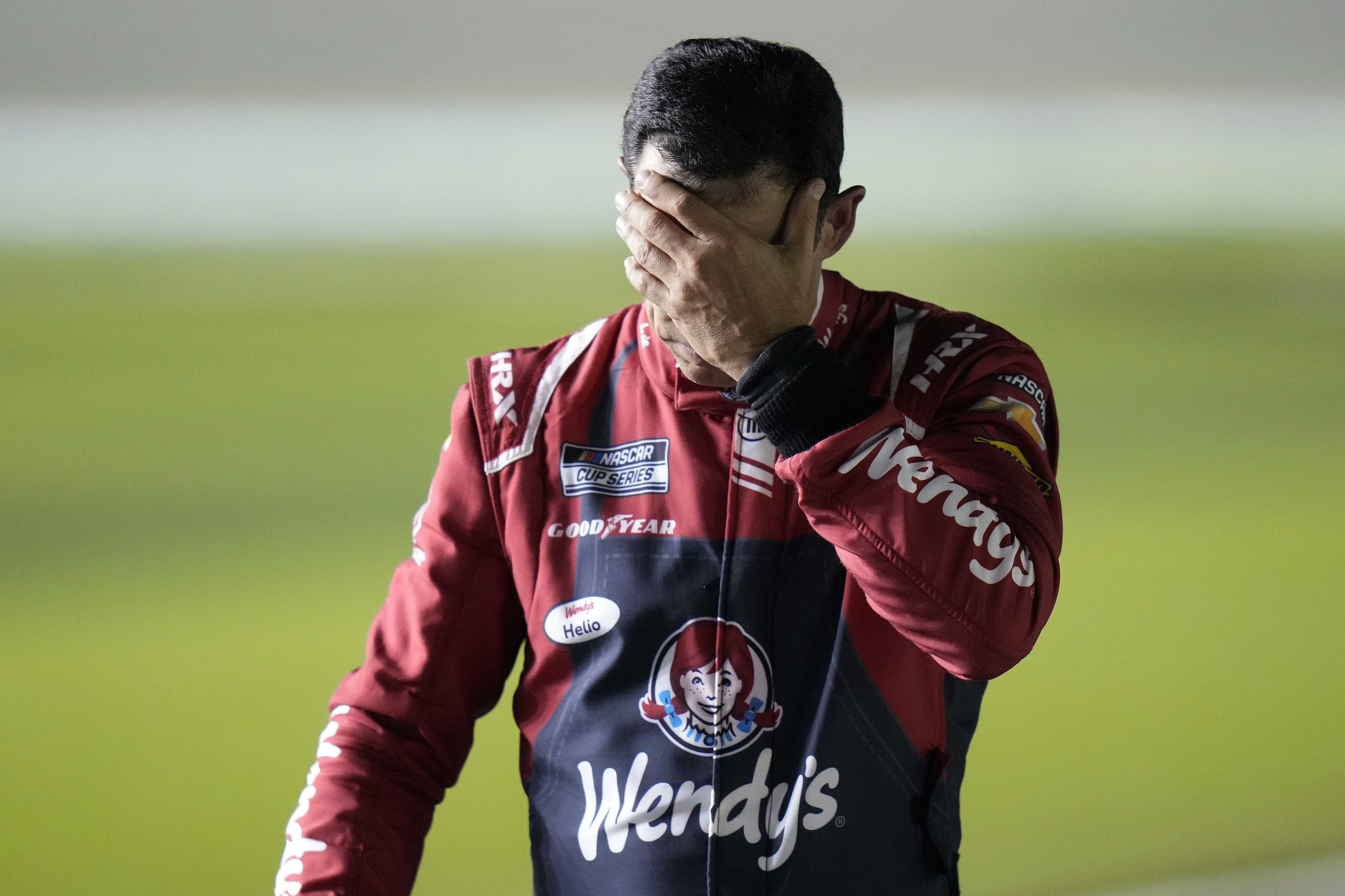Helio Castroneves, of Brazil, reacts after qualifying run for the NASCAR Daytona 500 auto race Wednesday, Feb. 12, 2025, at Daytona International Speedway in Daytona Beach, Fla.
