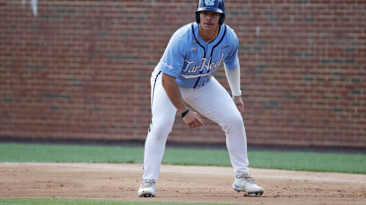 FILE - North Carolina's Alberto Osuna leads off first base during the second inning against Arkansas in an NCAA college super regional baseball game in Chapel Hill, N.C., June 12, 2022.