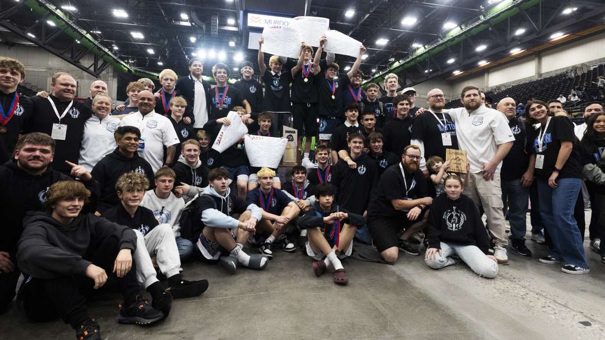 Layton celebrates their state championship victory in the 6A wrestling state championships at UVU in Orem on Thursday, Feb. 13, 2025.