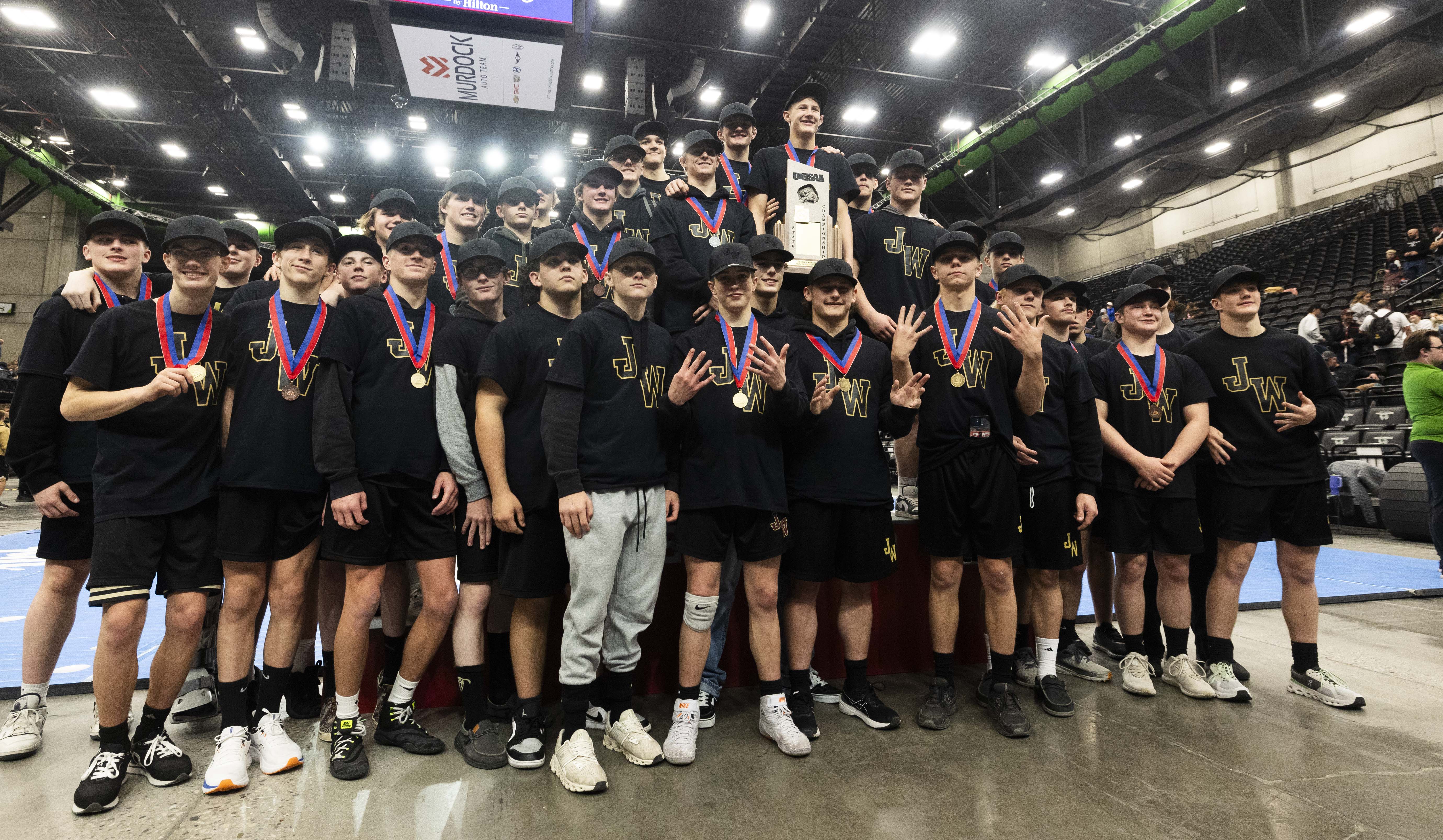 Juab celebrates its ninth state championship victory in a row at the 3A wrestling state championships at UVU in Orem on Thursday, Feb. 13, 2025.