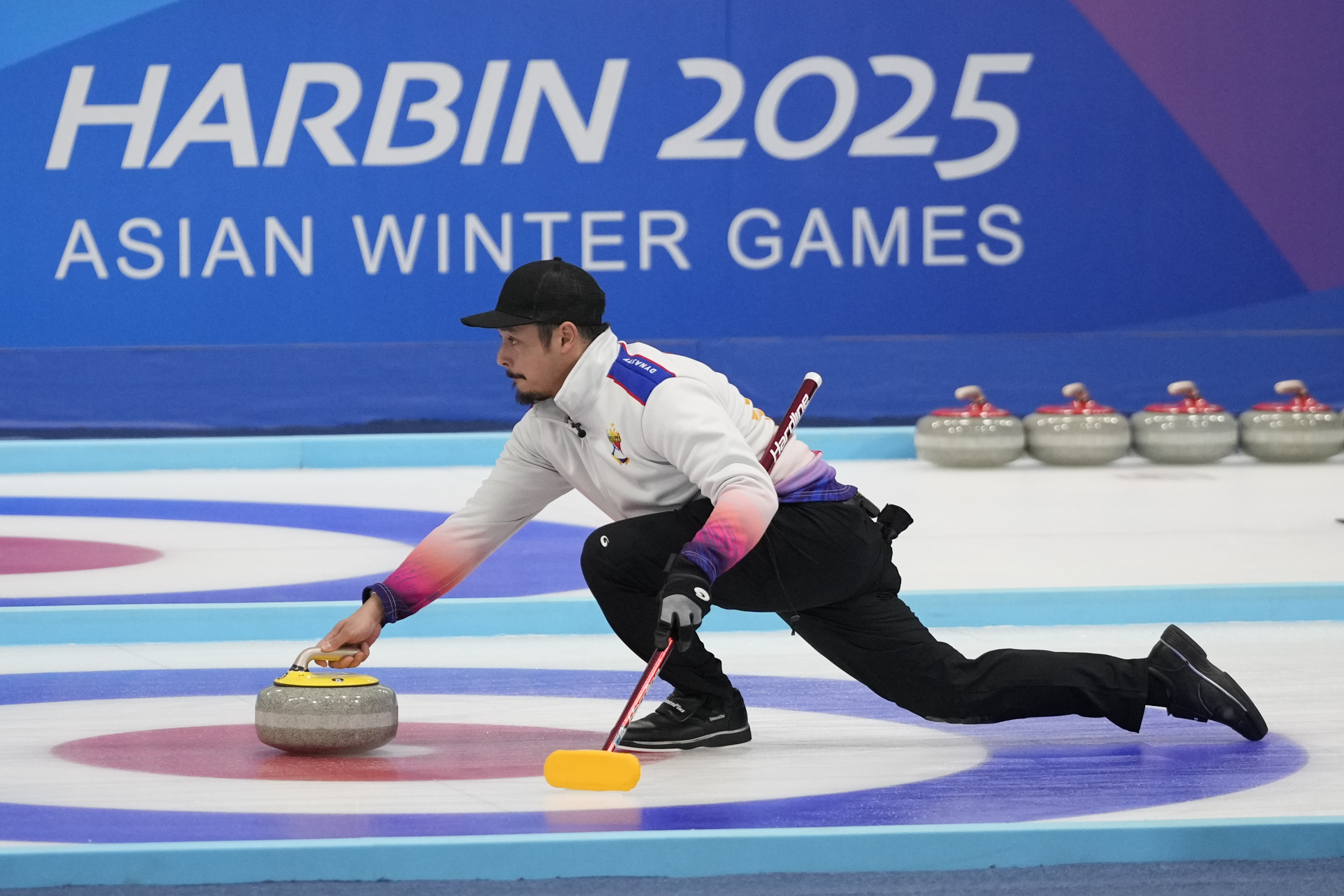 Philippines Marc Pfister compete against South Korea during the finals of men's curling at the 9th Asian Winter Games in Harbin, China on Friday, Feb. 14, 2025.