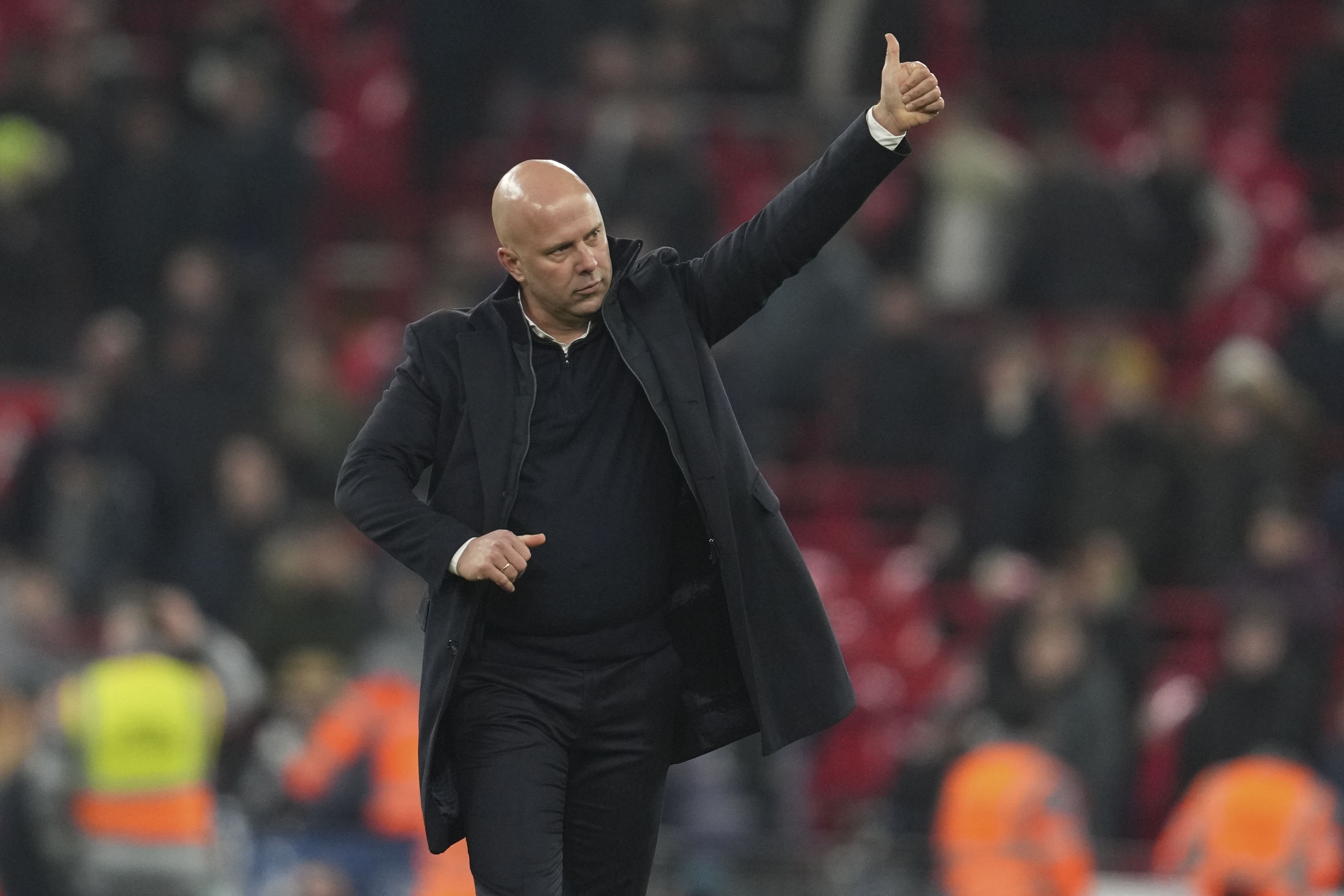 Liverpool's manager Arne Slot greets the crowd after winning the English League Cup semifinal second leg soccer match between Liverpool and Tottenham Hotspur at Anfield Stadium in Liverpool, England, Thursday, Feb. 6, 2025.