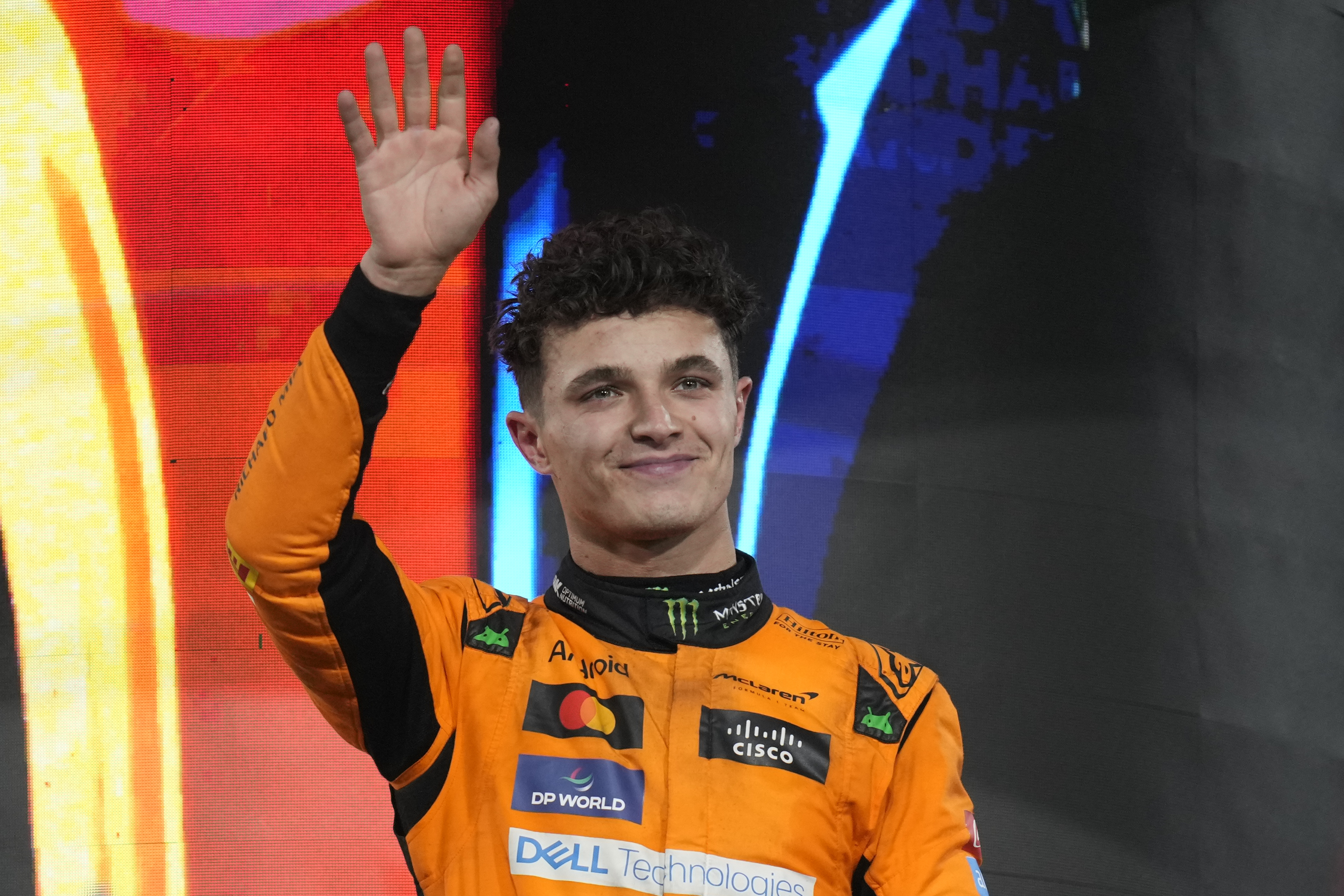 FILE - McLaren driver Lando Norris of Britain stands on the podium after winning the Formula One Abu Dhabi Grand Prix at the Yas Marina Circuit in Abu Dhabi, UAE, on Dec. 8, 2024.