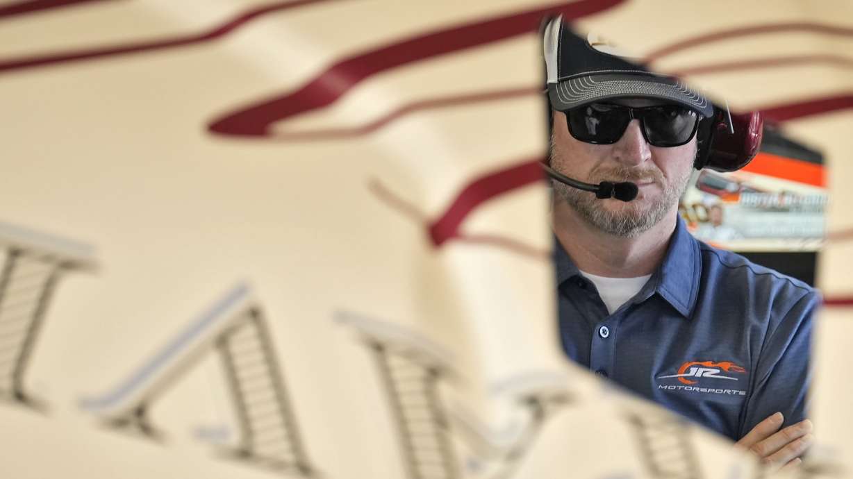 Former driver Dale Earnhardt Jr., watches as a crew works on Justin Allgaier's car during a practice for the NASCAR Daytona 500 auto race Wednesday, Feb. 12, 2025, at Daytona International Speedway in Daytona Beach, Fla.