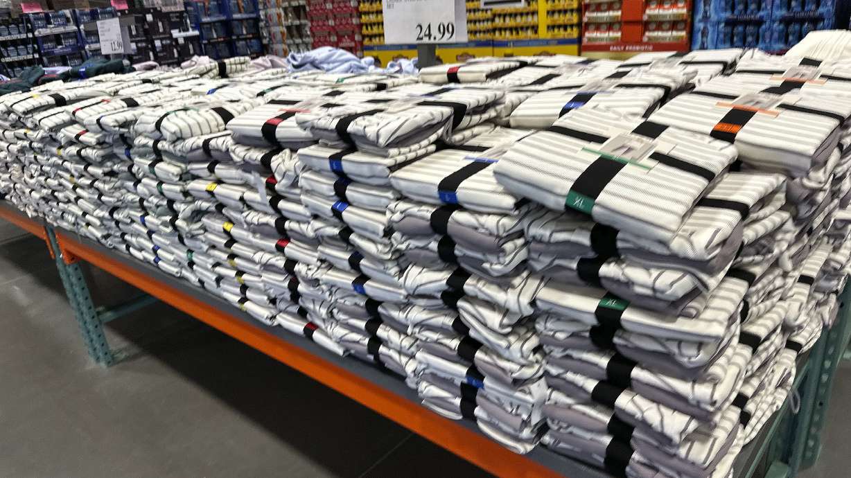 A table is stacked with striped lounge sets in a Costco warehouse Feb. 3, in east Denver. Retail sales fell 0.9% in January from the previous month, the Commerce Department said Friday.