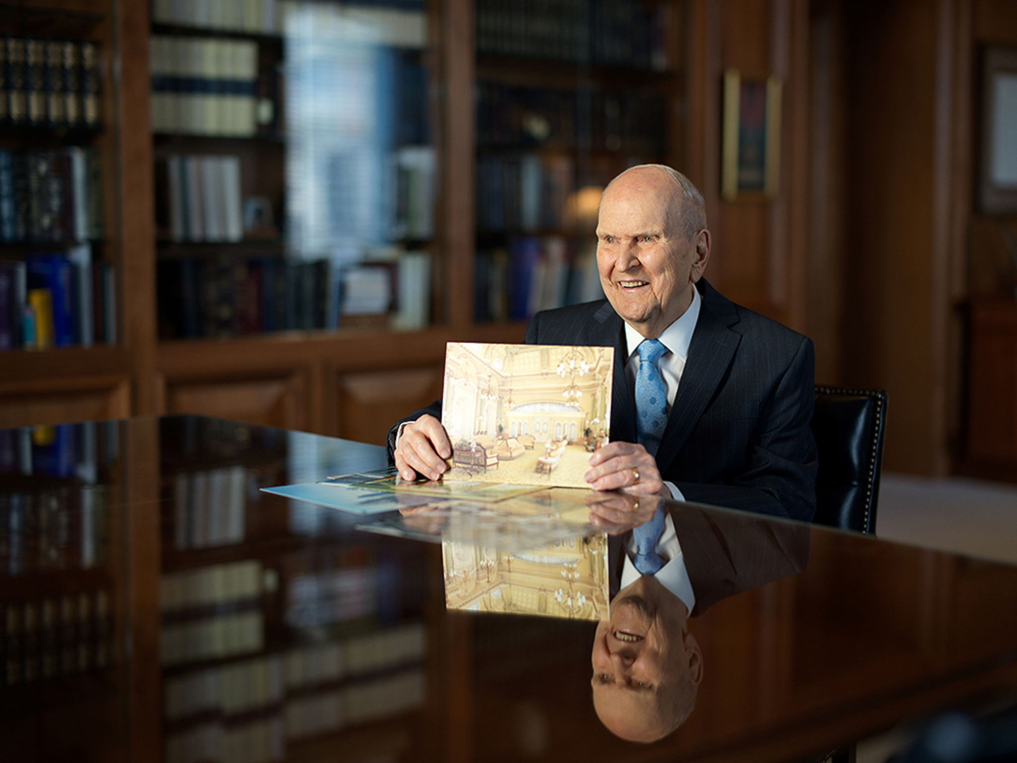 President Russell M. Nelson holds a rendering of the Salt Lake Temple celestial room in a Jan. 30 photo posted on his social media accounts Friday. He announced a unique public open house for the historic temple will be held for six months in 2027.
