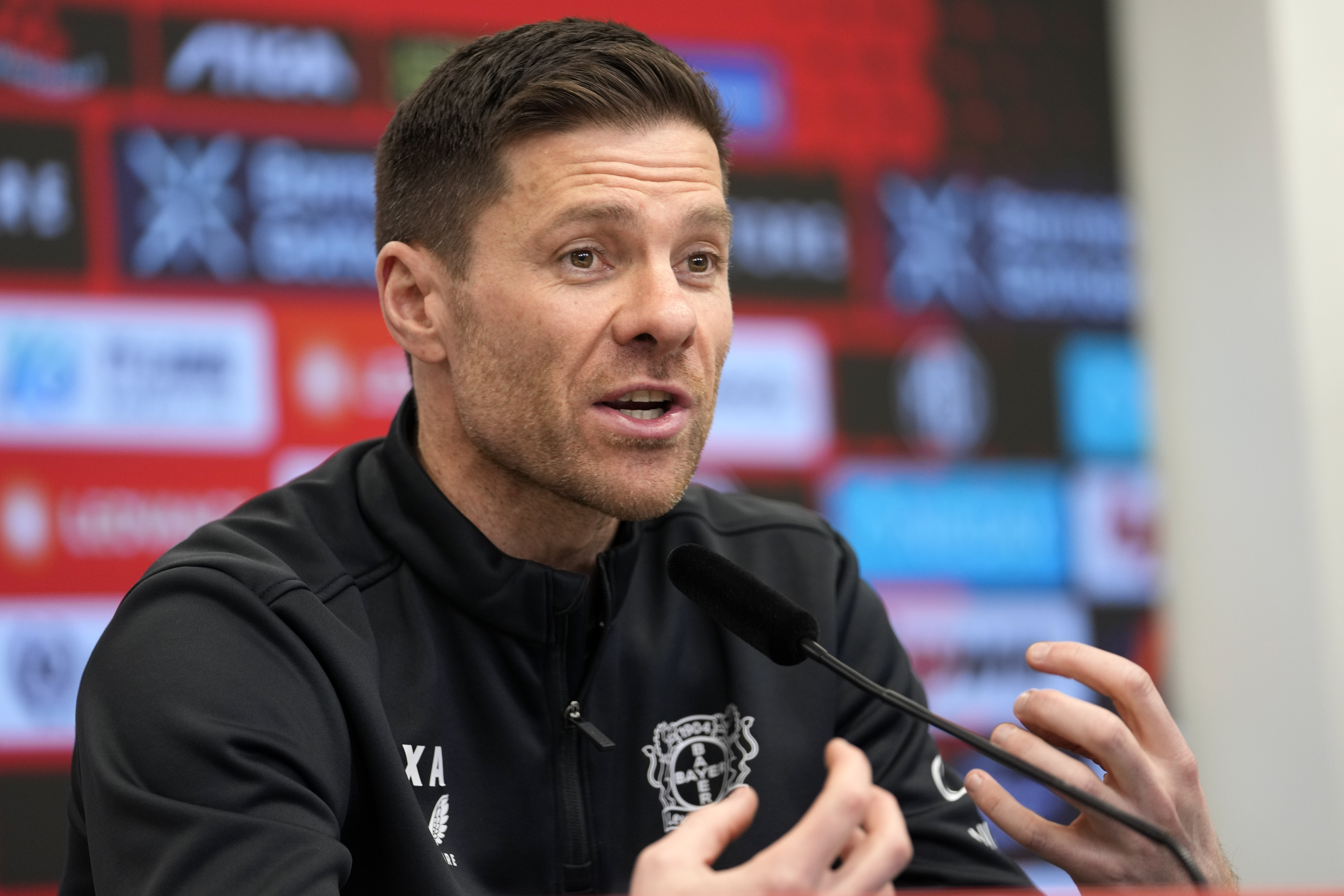 Leverkusen's head coach Xabi Alonso talks to the media during a press conference ahead of the Bundesliga top soccer match between Bayer Leverkusen and Bayern Munich in Leverkusen, Germany, Friday, Feb. 14, 2025.