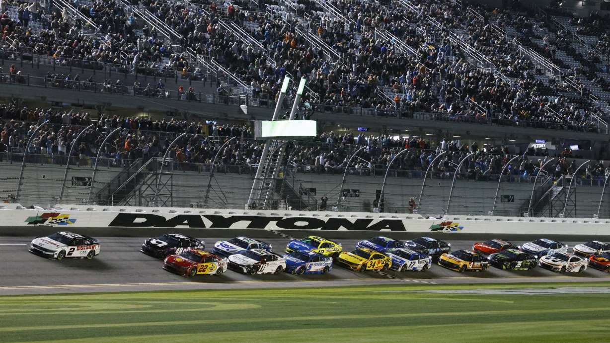 Austin Cindric (2) and Joey Logano (22) lead the field to start the second of two NASCAR Daytona 500 qualifying auto races at Daytona International Speedway, Thursday, Feb. 13, 2025, in Daytona Beach, Fla.