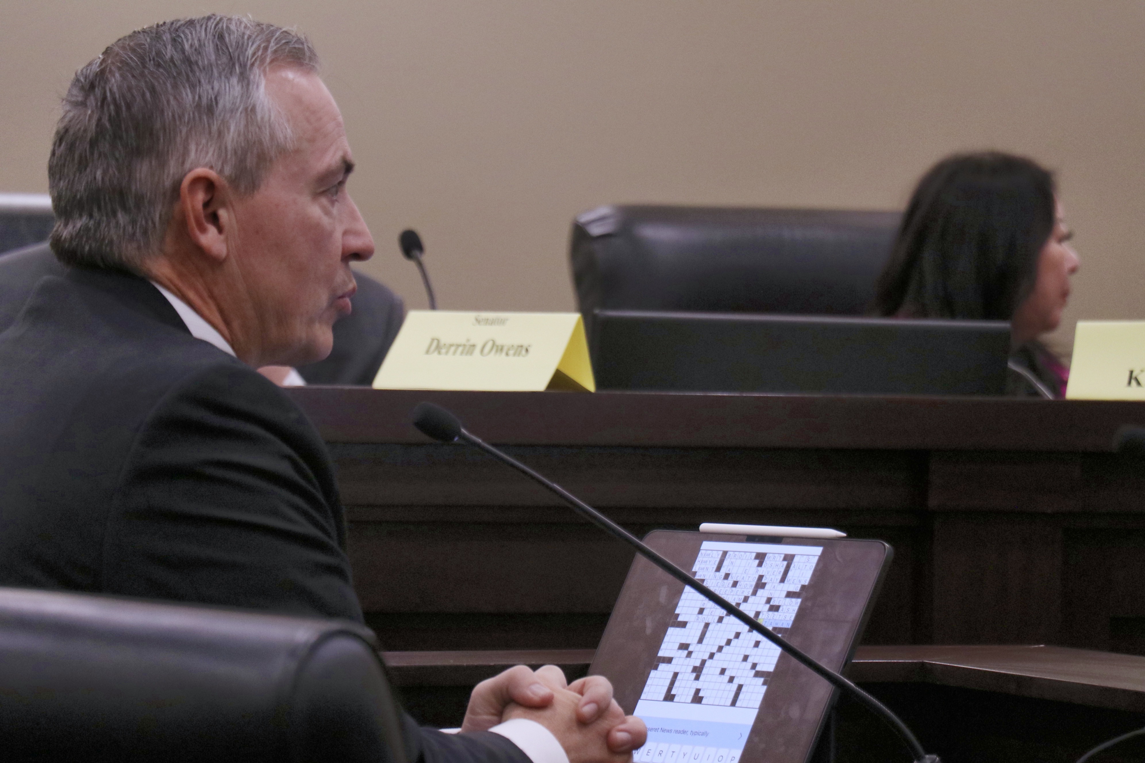 Sen. Dan McCay, R-Riverton, presents a 2023 New York Times crossword puzzle that used "Utahan" as an answer during a Senate committee meeting on a proposed bill that would make "Utahn" the state's official demonym on Thursday. 