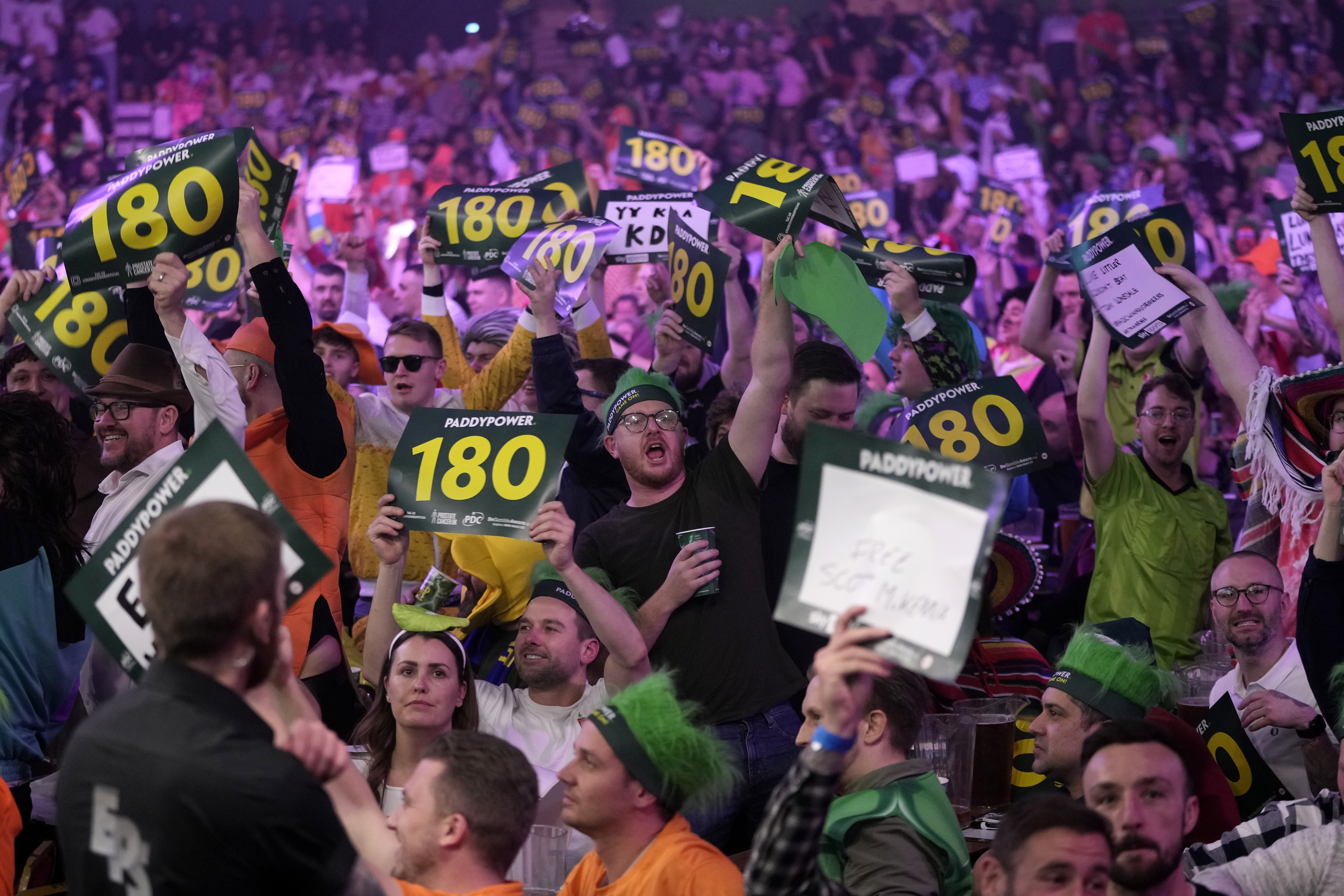 FILE - Fans cheer during the final match between Luke Littler of England and Luke Humphries of England at the World Darts Championship, in London, Wednesday, Jan. 3, 2024.