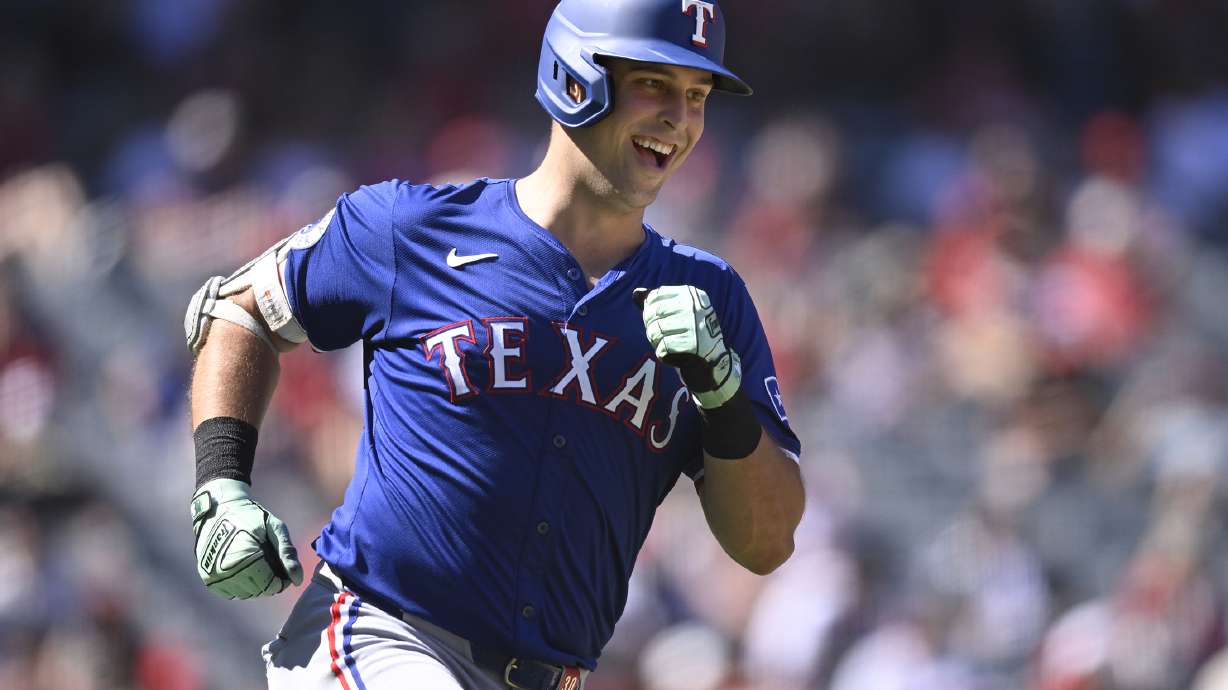 FILE - Texas Rangers' Nathaniel Lowe runs the bases after hitting a home run during the eighth inning of a baseball game against the Los Angeles Angels, Sunday, Sept. 29, 2024, in Anaheim, Calif.