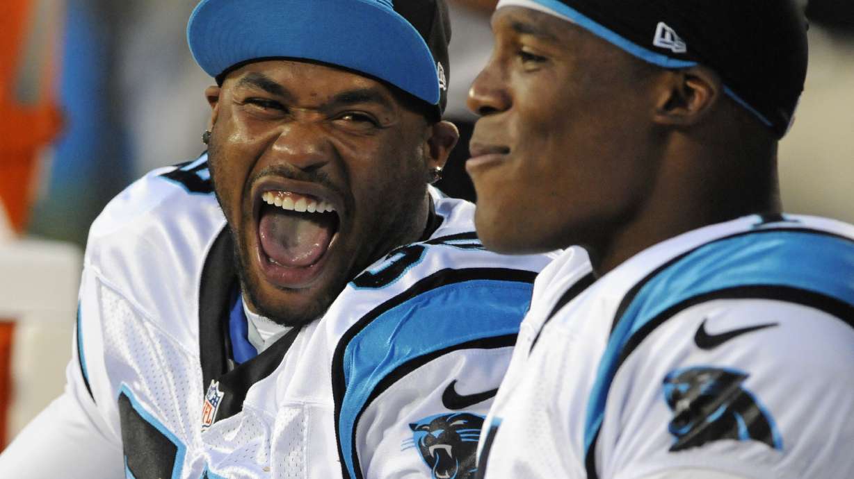 FILE - Carolina Panthers' Steve Smith, left, and Cam Newton, right, share a laugh during the first half of an NFL preseason football game against the Pittsburgh Steelers, Thursday, Aug. 29, 2013, in Charlotte, N.C.