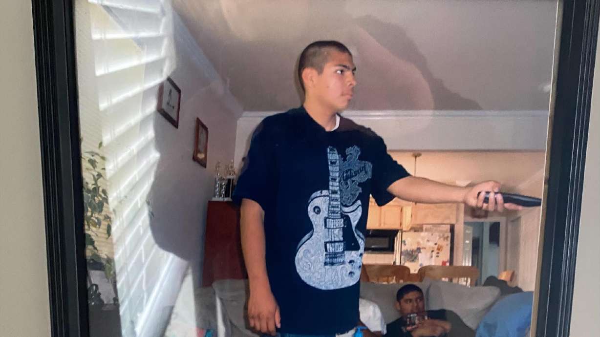 A picture of Marvin Lopez, who was shot and killed in 2016, hangs in the home of his mother, Maria Perez. Earlier this month, Unified police announced an arrest in the case.