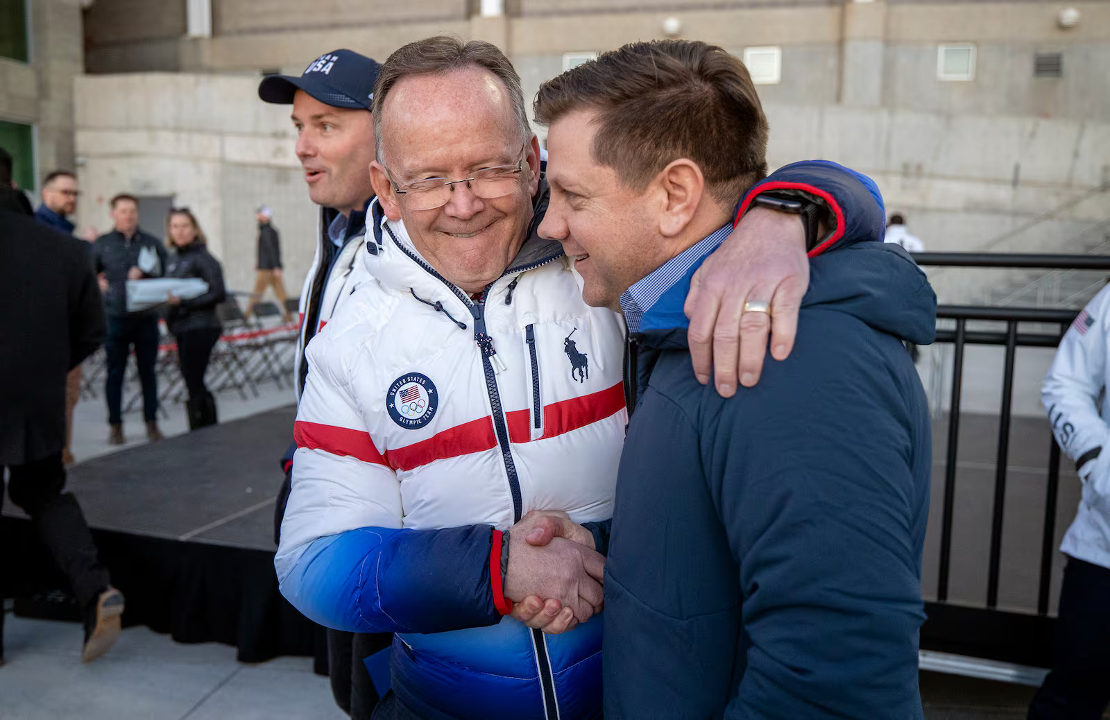 President Stuart Adams, of the Utah Senate, and Steve Starks, CEO of Larry H. Miller Group of Companies, talk at Rice-Eccles Stadium at the University of Utah on Tuesday, Feb. 8, 2022, prior to watching the Olympic Cauldron be lit, marking the 20-year anniversary of the Salt Lake 2002 Olympics opening ceremony.