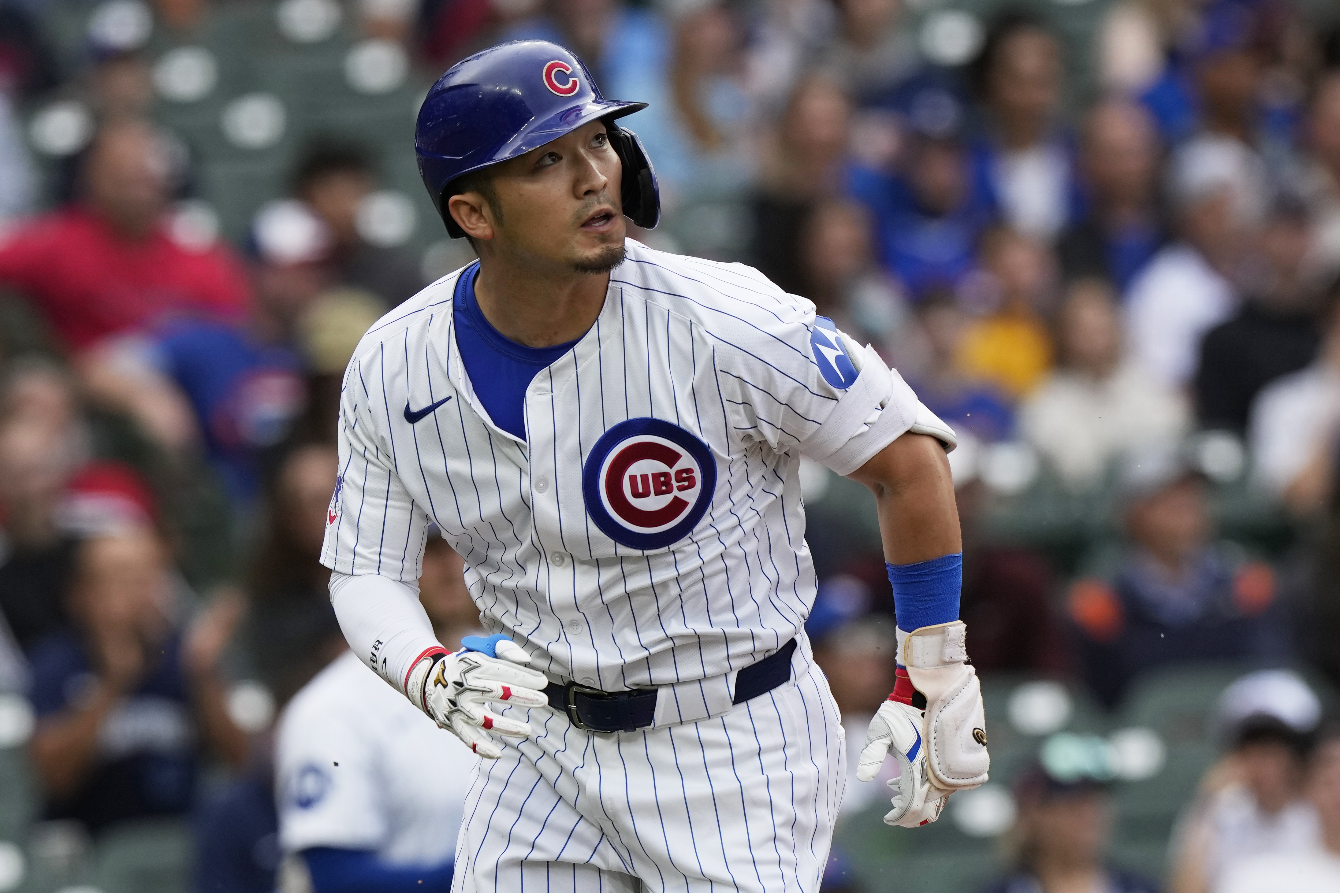 FILE - Chicago Cubs' Seiya Suzuki, of Japan, watches after hitting a one-run single during the first inning of a baseball game against the Washington Nationals in Chicago, Sunday, Sept. 22, 2024.