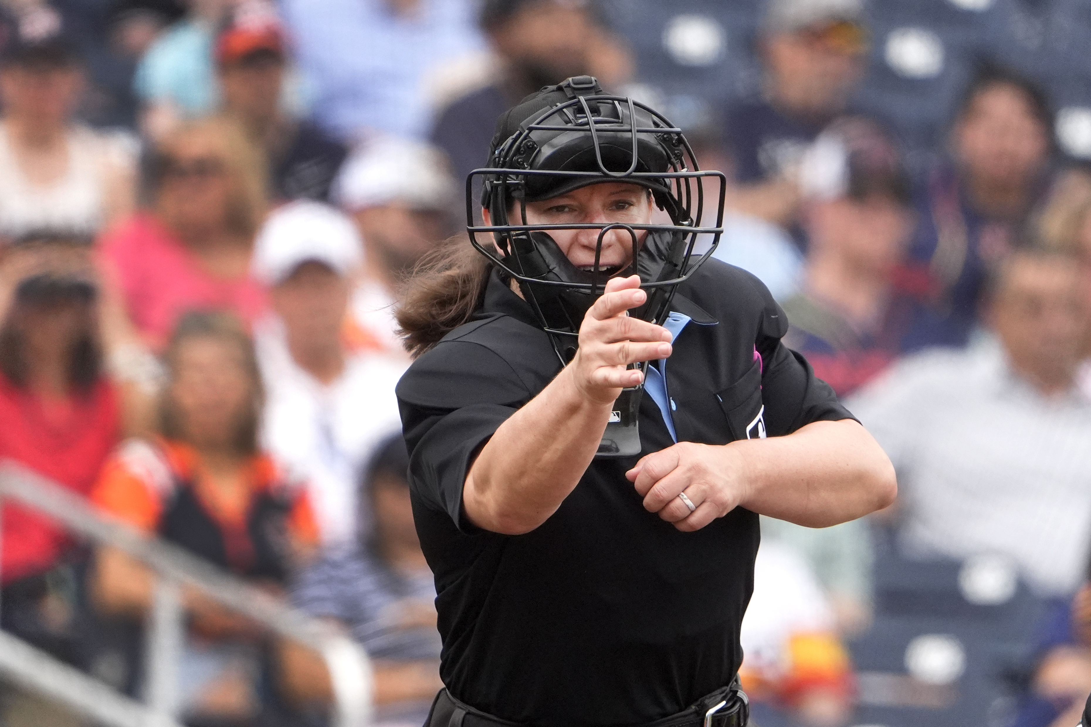 FILE - Home plate umpire Jen Pawol calls a strike during the third inning of a spring training baseball game between the Miami Marlins and Houston Astros Sunday, March 10, 2024, in West Palm Beach, Fla.