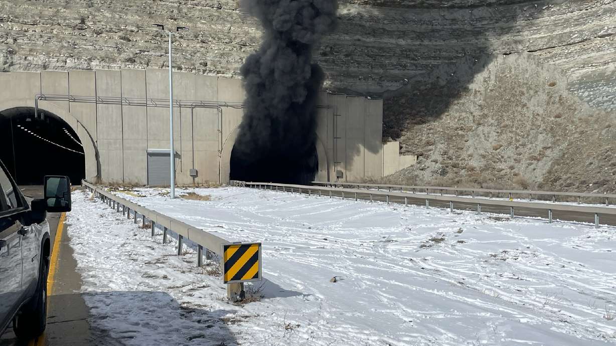 Emergency crews respond to a fatal crash that shut down a tunnel along I-80 near Green River, Wyo., on Feb. 14. Investigators released a preliminary report Wednesday detailing the crash that involved 26 vehicles and killed three people.