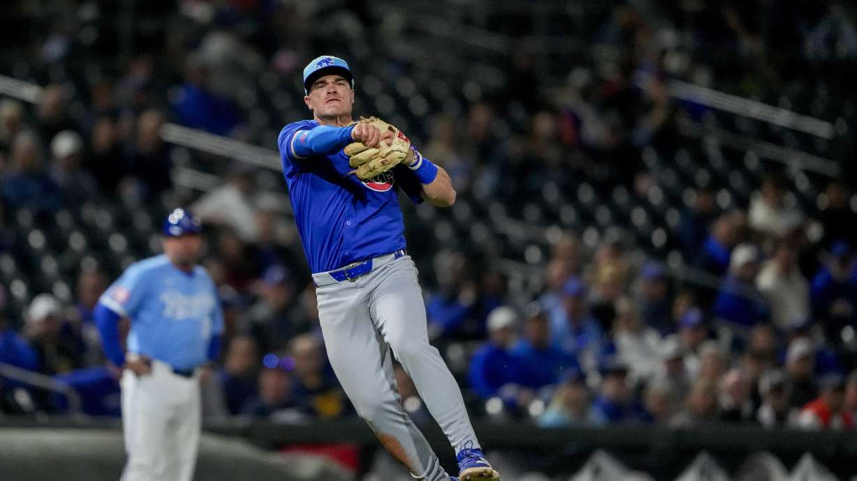 FILE - Chicago Cubs third baseman Matt Shaw makes a throw to first base during a spring training baseball game in Surprise, Ariz., March 5, 2024.