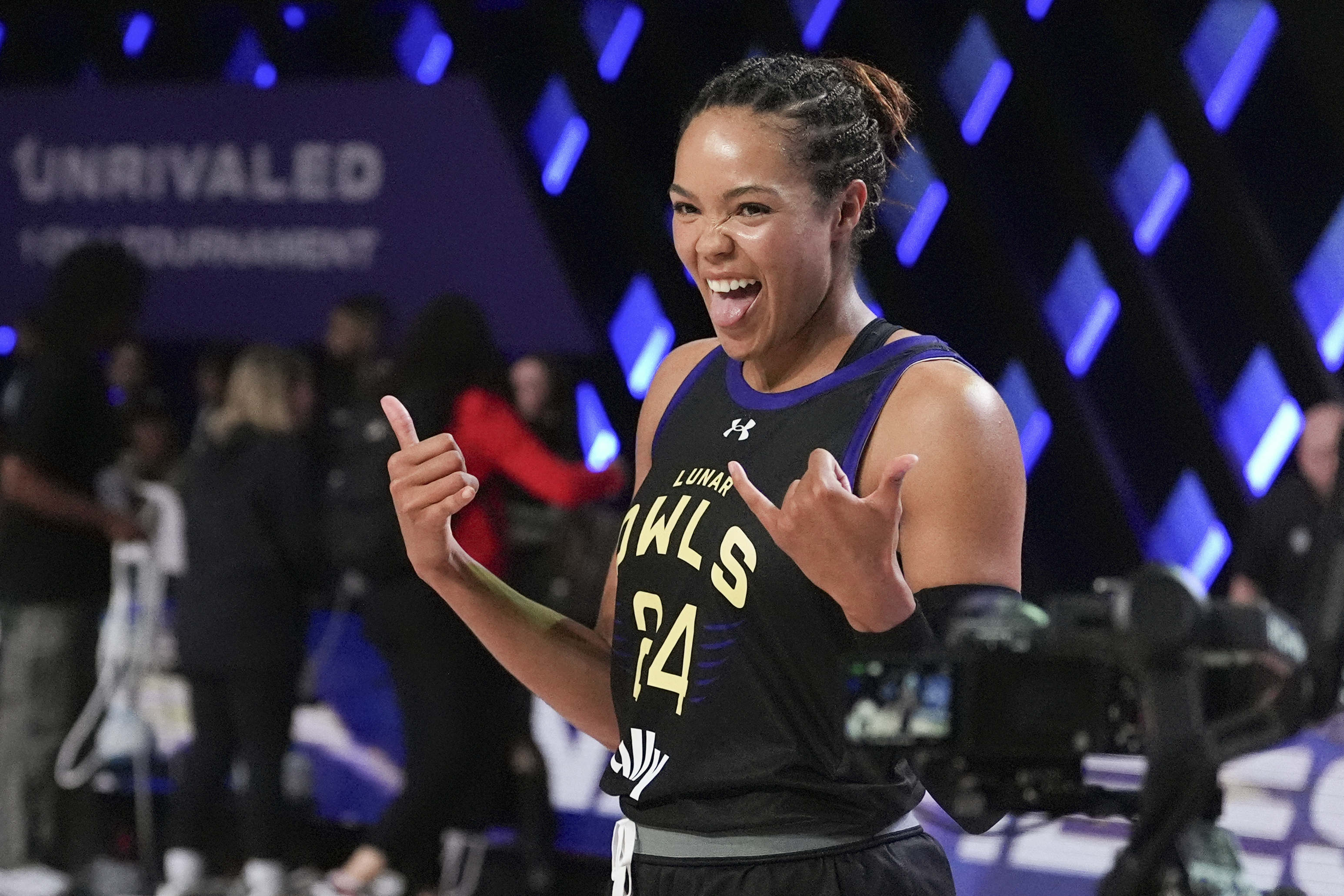 Napheesa Collier celebrates after defeating Aaliyah Edwards in the Unrivaled 1-on-1 basketball final, in Friday, Feb. 14, 2025, in Medley, Fla.