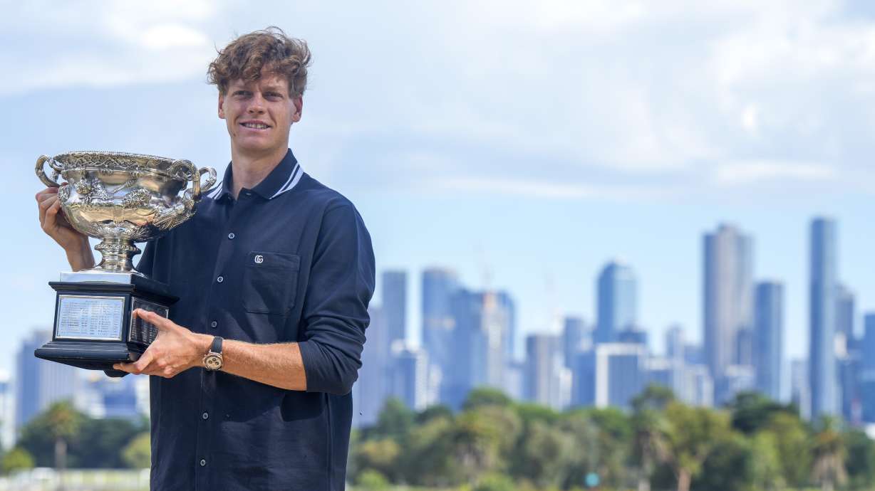 Jannik Sinner of Italy poses with Norman Brookes Challenge Cup the morning after defeating Alexander Zverev of Germany in the men's singles final at the Australian Open tennis championship in Melbourne, Australia, Monday, Jan. 27, 2025.