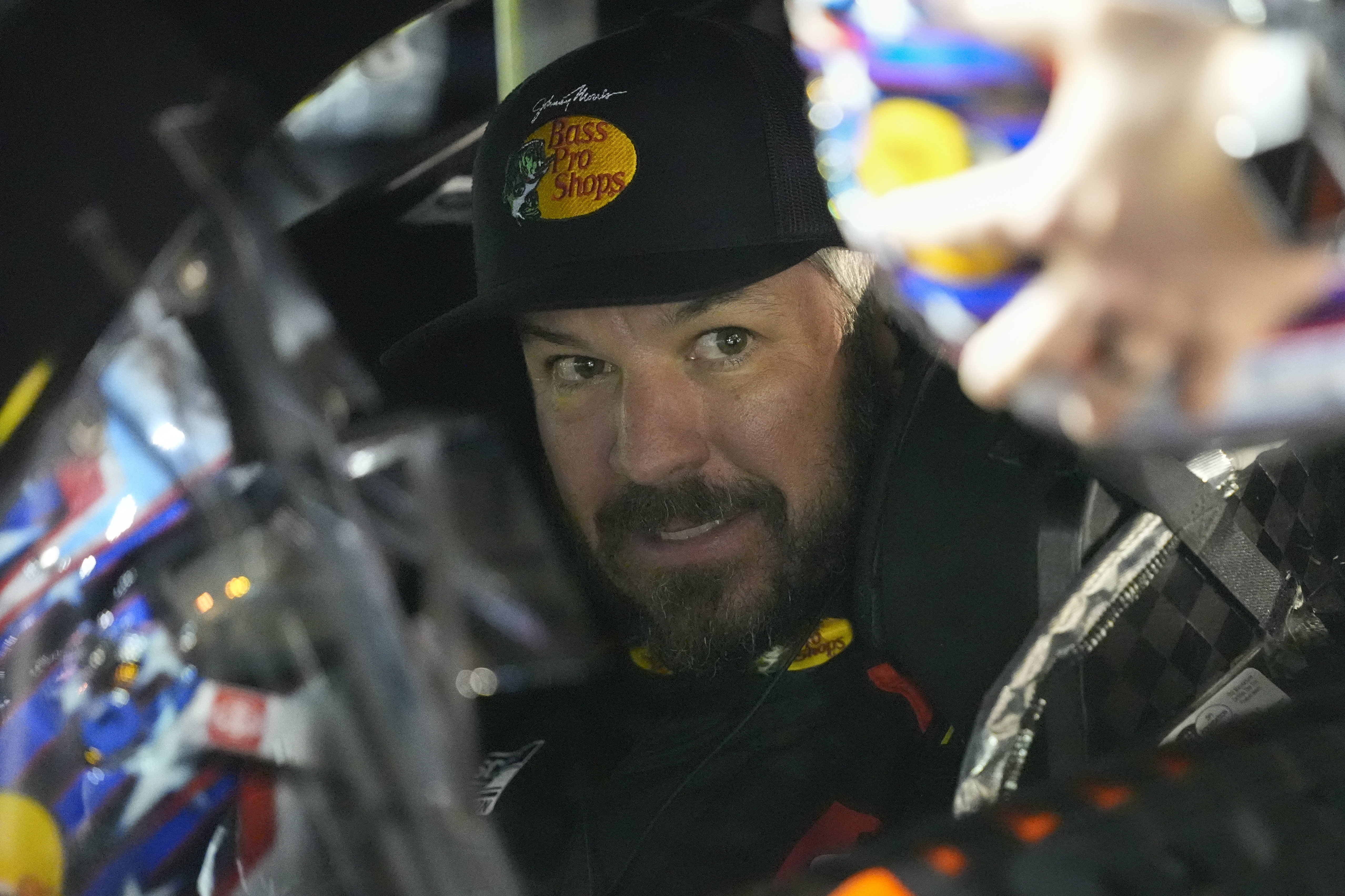 Martin Truex Jr., in his car, prepares for the start of the first of two NASCAR Daytona 500 qualifying auto races at Daytona International Speedway, Thursday, Feb. 13, 2025, in Daytona Beach, Fla.