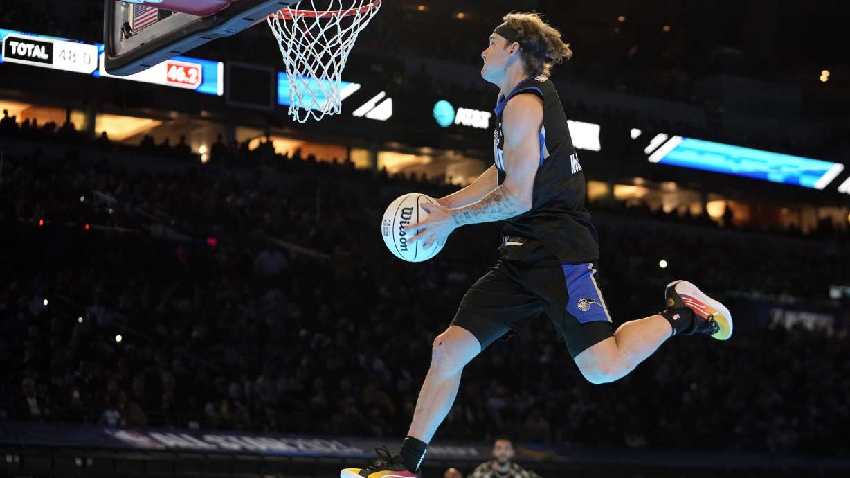 FILE - Osceola Magic's Mac McClung dunks during the slam dunk competition at the NBA basketball All-Star weekend, Saturday, Feb. 17, 2024, in Indianapolis.