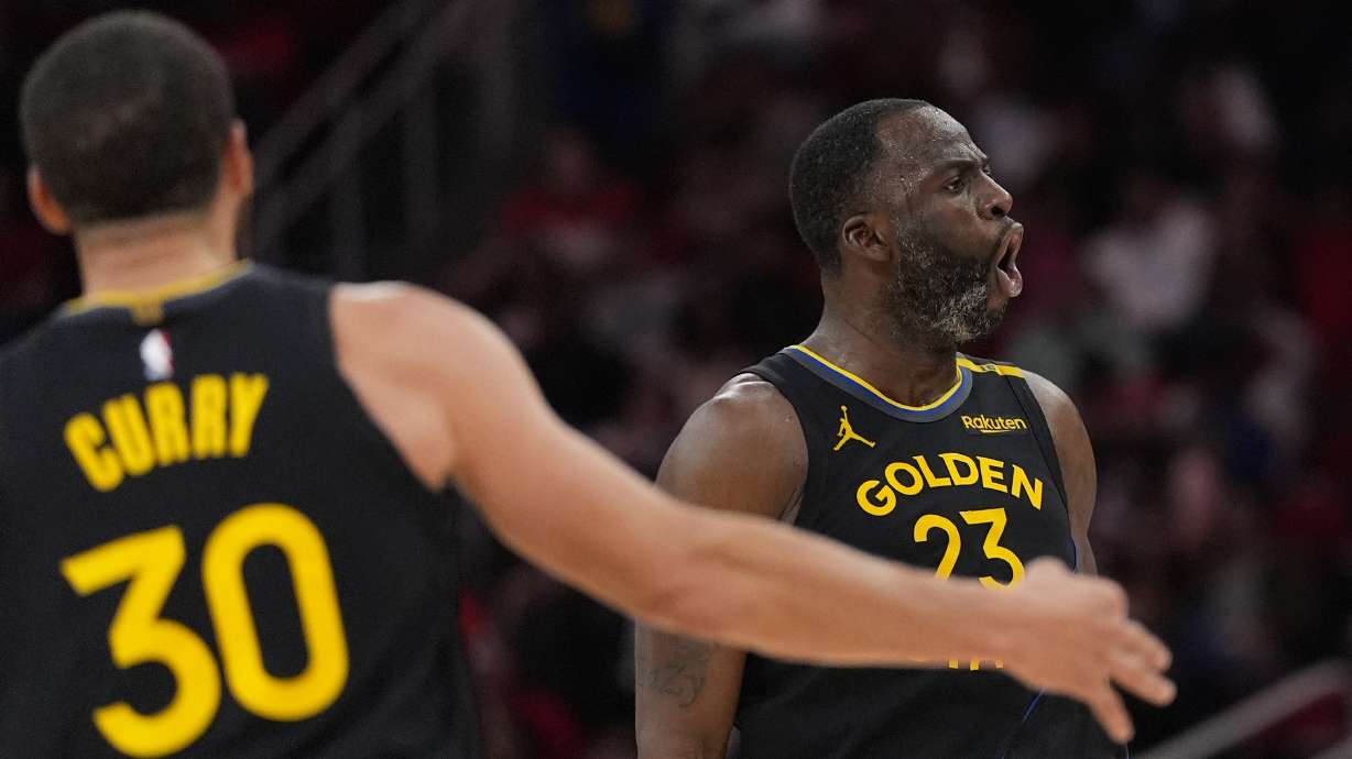 Golden State Warriors' Draymond Green (23) celebrates after making a 3-pointer against the Houston Rockets during the second half of an NBA basketball game Thursday, Feb. 13, 2025, in Houston.