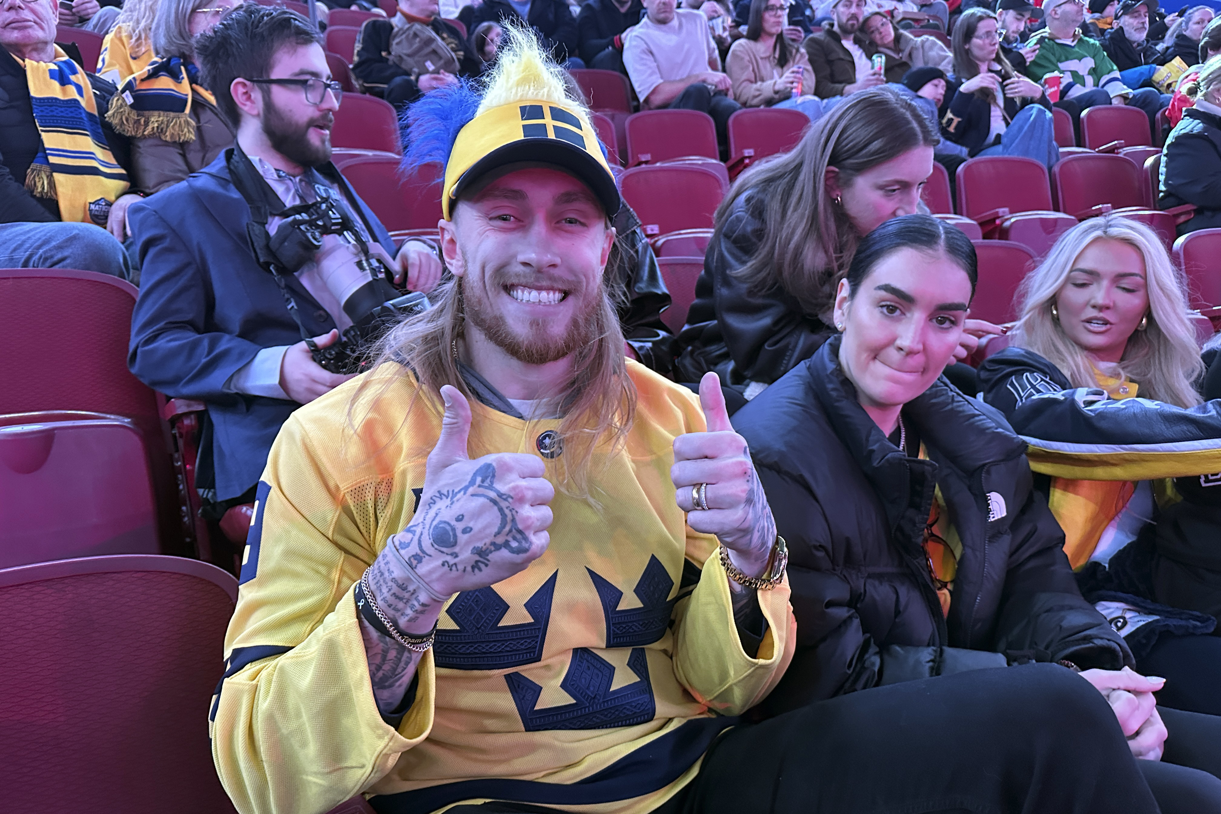San Francisco 49ers tight end George Kittle and his wife Claire attend the 4 Nations Face-Off hockey game between Sweden and Finland, Saturday, Feb. 15, 2025, in Montreal.