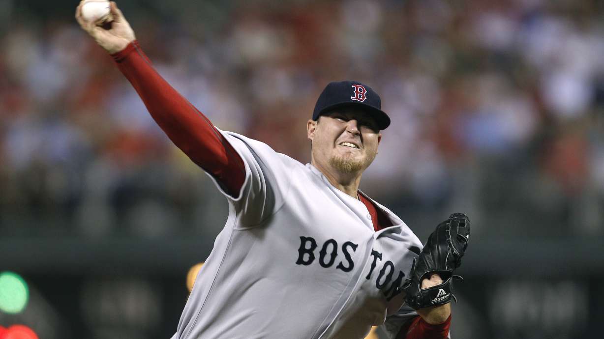 FILE - In this June 28, 2011 file photo, Boston Red Sox pitcher Bobby Jenks throws during a baseball game against the Philadelphia Phillies in Philadelphia.