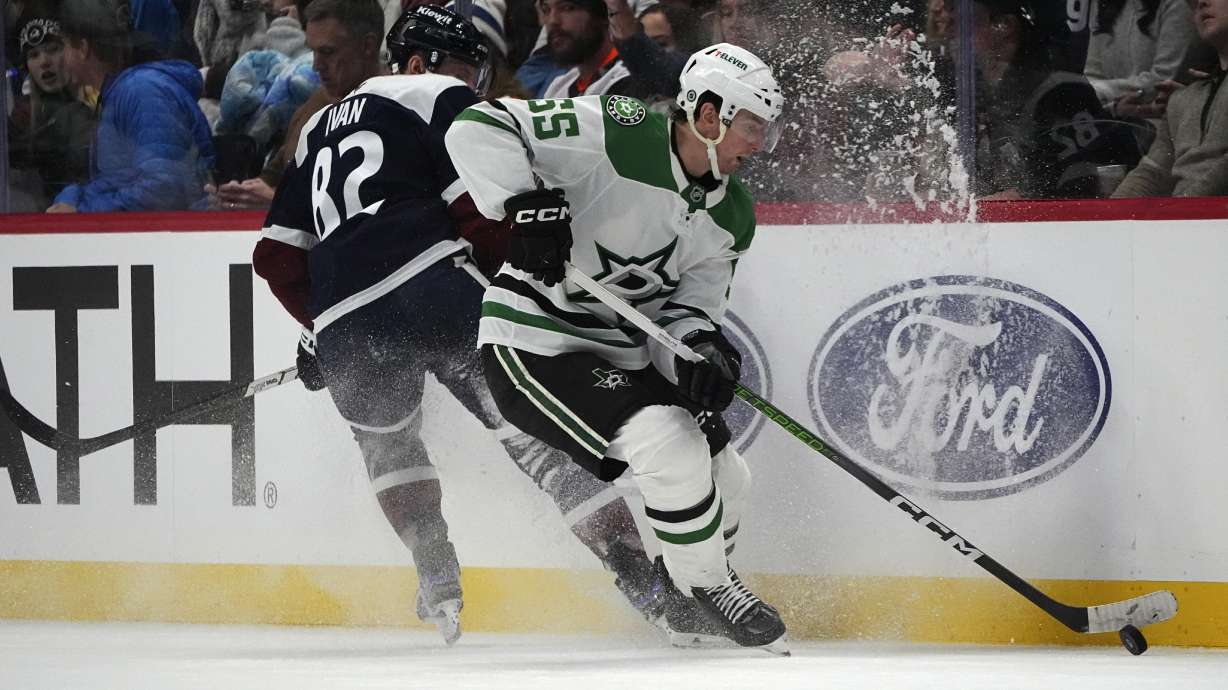 Dallas Stars defenseman Thomas Harley, right, collects the puck as Colorado Avalanche center Ivan Ivan, left, defends in the third period of an NHL hockey game Saturday, Jan. 18, 2025, in Denver.