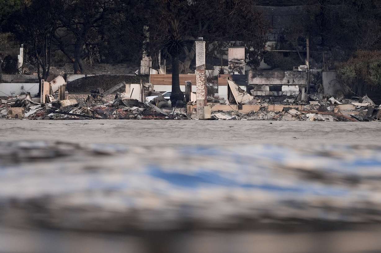 Properties damaged by the Palisades Fire are seen from a coastline perspective on Jan. 17, in Malibu, Calif.
