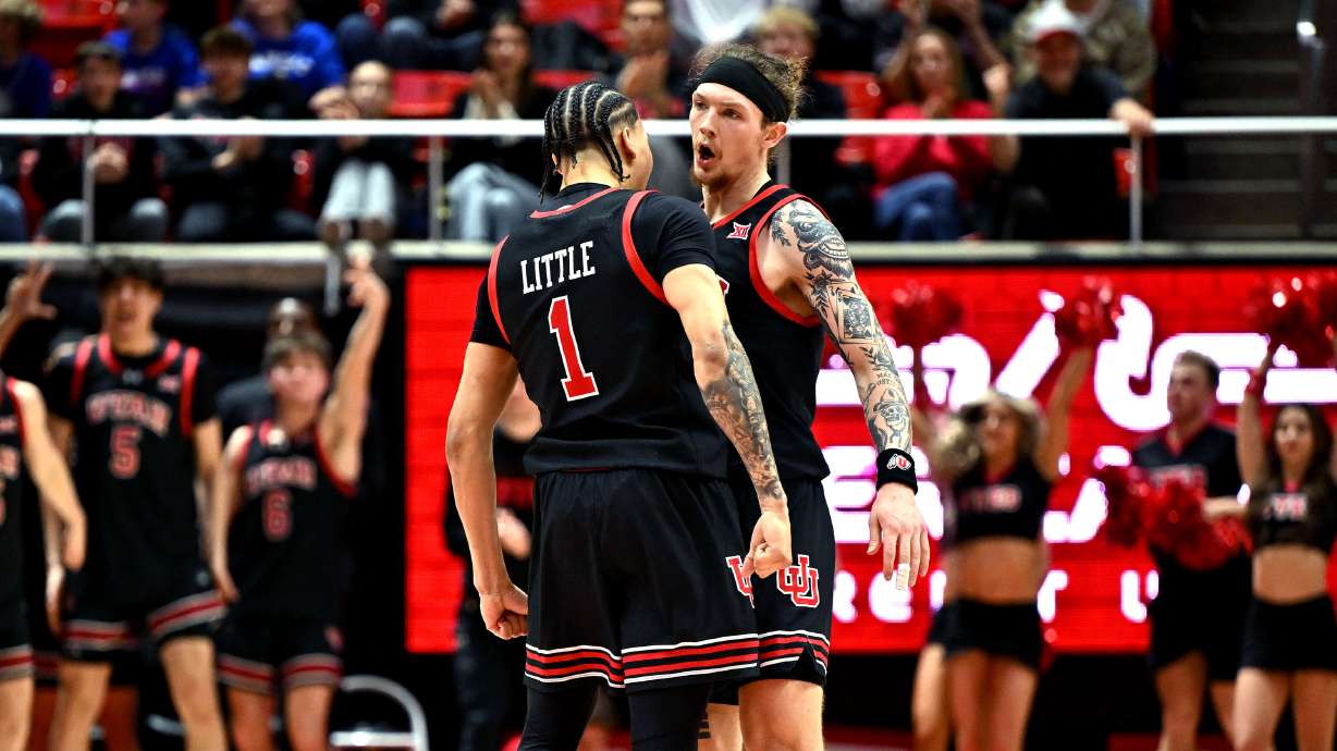 Utah Utes guard Miro Little (1) and Utah Utes guard Gabe Madsen (55) celebrate as Utah and Kansas play in Salt Lake City, at the Huntsman Center on Saturday February 15, 2025.