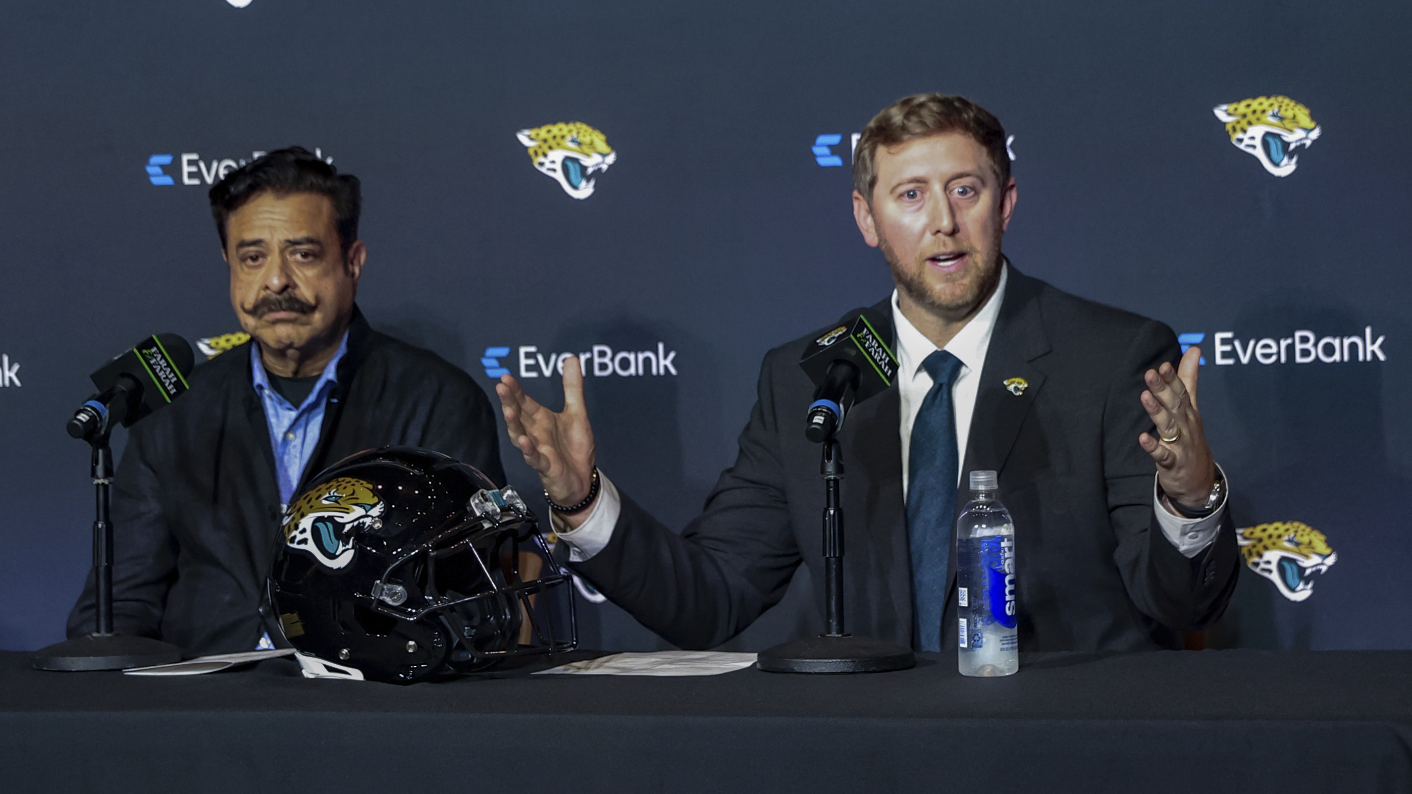 Jacksonville Jaguars owner Shahid Khan, left, and new head coach Liam Coen, right, speak with the media during an NFL football news conference in Jacksonville, Fla., Monday, Jan. 27, 2025.
