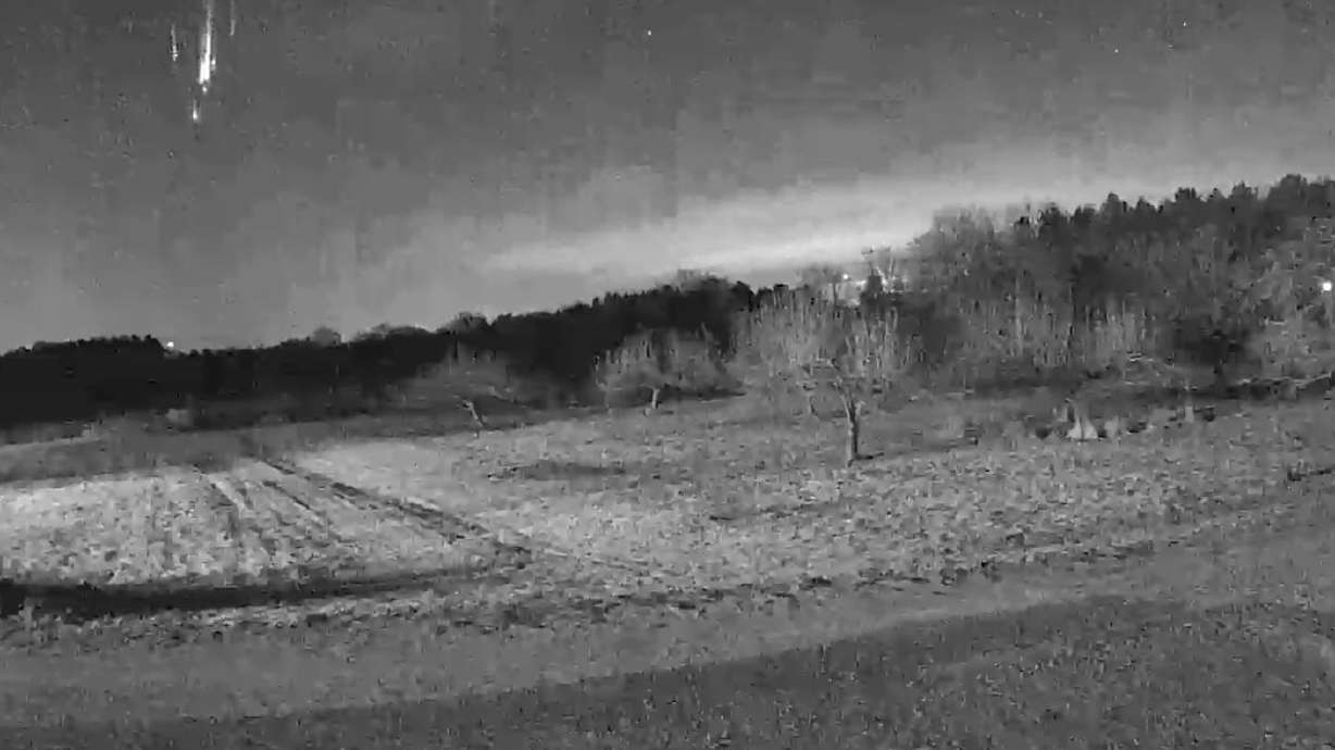 Remnants of a satellite fall through the night sky in Wisconsin Jan. 28.