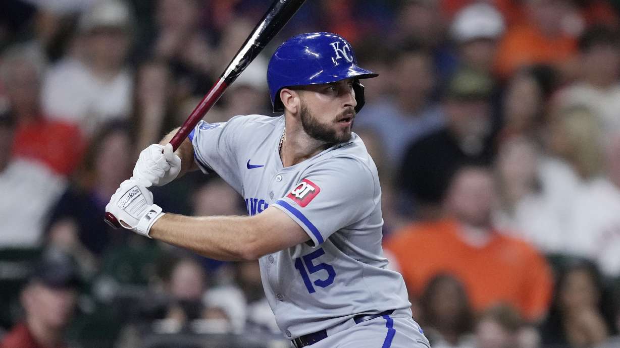 FILE - Kansas City Royals designated hitter Paul DeJong bats during the second inning of a baseball game against the Houston Astros, Aug. 29, 2024, in Houston.