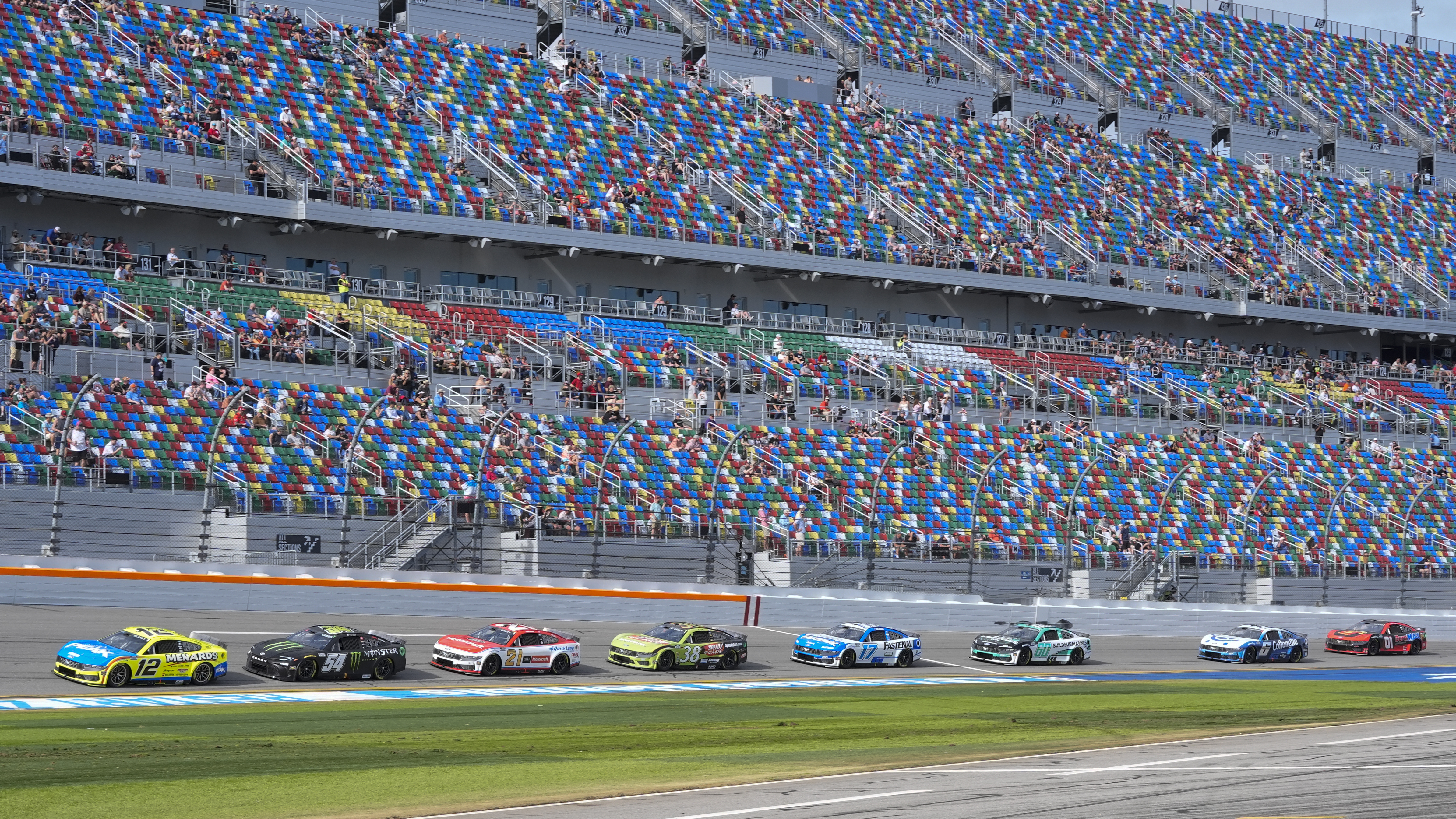 Ryan Blaney (12) leads a pack of cars on the front stretch during a practice session for the NASCAR Daytona 500 auto race at Daytona International Speedway, Saturday, July 15, 2025, in Daytona Beach, Fla.