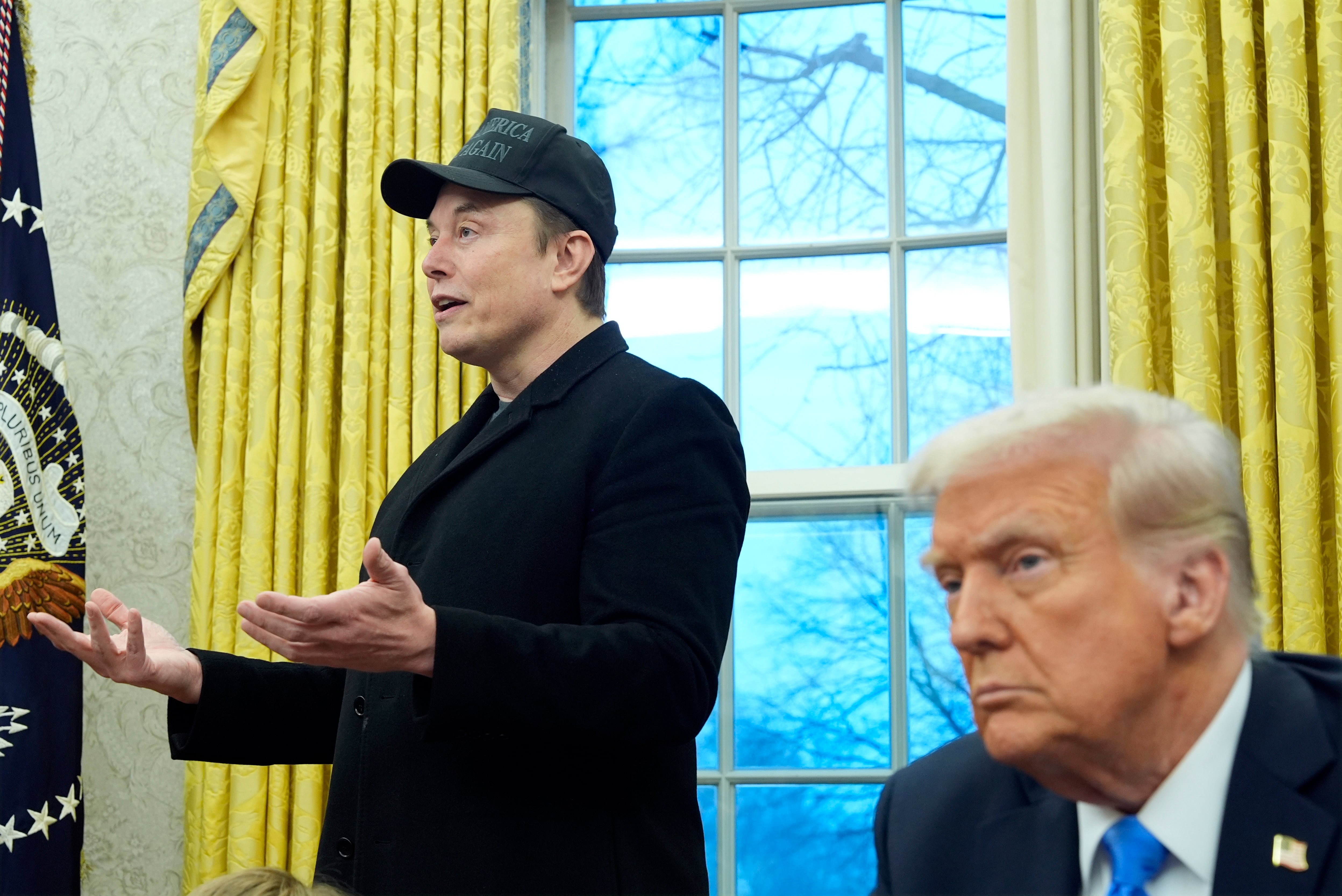 President Donald Trump listens as Elon Musk speaks in the Oval Office at the White House, Feb. 11, in Washington. The lightning speed with which Musk is operating has left many lawmakers scrambling to keep up.