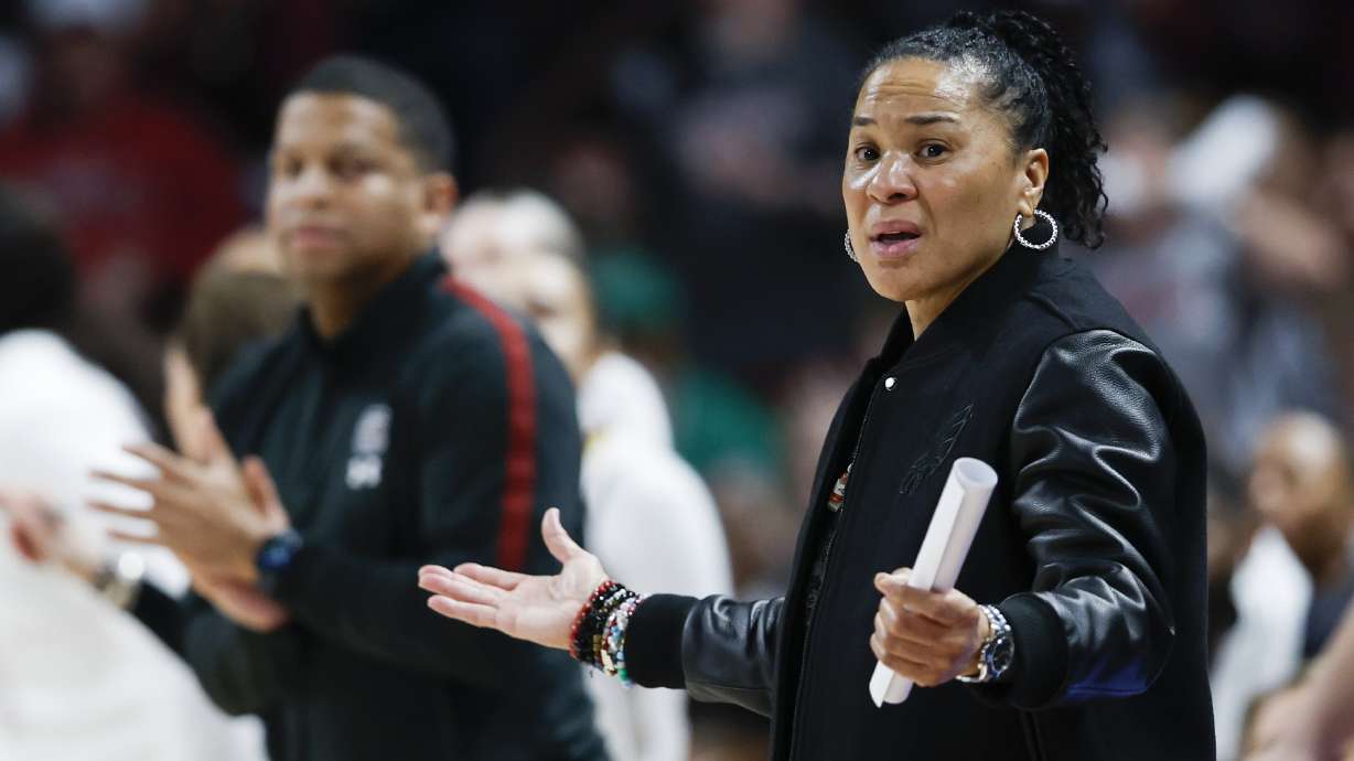 South Carolina head coach Dawn Staley reacts as her team plays against UConn during the first half of an NCAA college basketball game in Columbia, S.C., Sunday, Feb. 16, 2025.