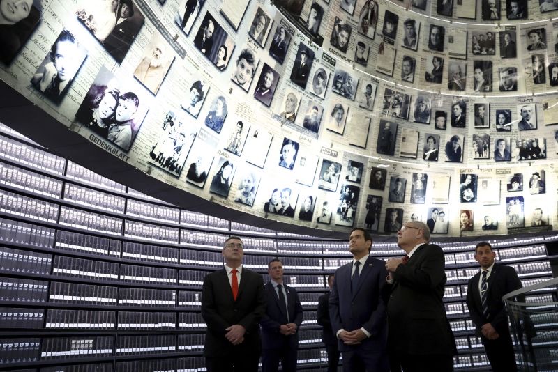 Secretary of State Marco Rubio, front center, accompanied by Chairman of Yad Vashem Dani Dayan, front right, and Israel's Foreign Minister Gideon Sa'ar, left, tours Yad Vashem, the World Holocaust Remembrance Center, in Jerusalem, Israel, Sunday.