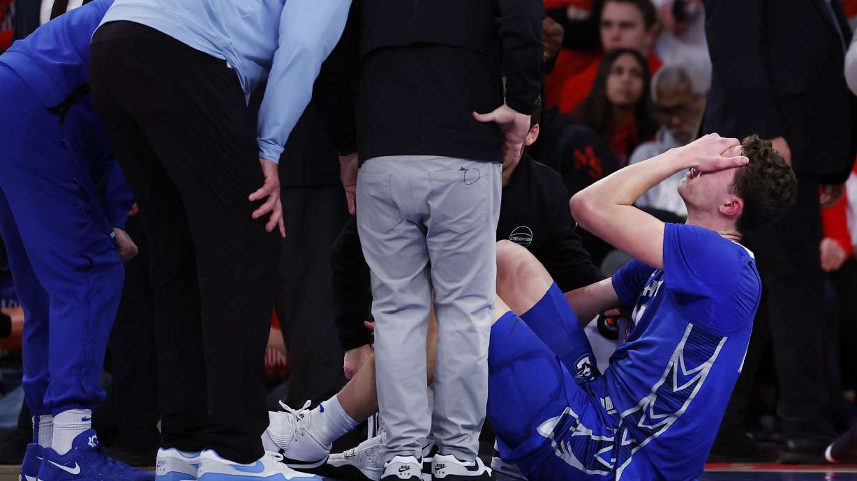 Creighton center Ryan Kalkbrenner reacts after an injury during the second half of an NCAA college basketball against St. John's, Sunday, Feb. 16, 2025, in New York.