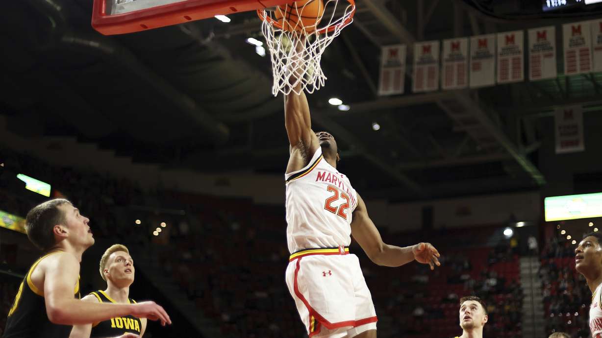 Maryland forward Jordan Geronimo (22) dunks during the second half of an NCAA college basketball game against Iowa, Sunday, Feb. 16, 2025, in College Park, Md.