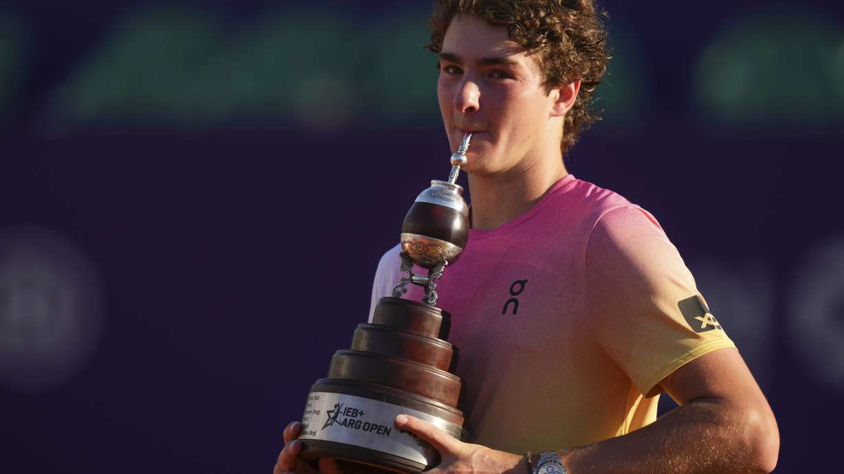 Brazil's Joao Fonseca poses with the trophy after defeating Argentina's Francisco Cerundolo in a men's doubles final match at the Argentina Open ATP tennis tournament at Guillermo Vilas Stadium in Buenos Aires, Argentina, Sunday, Feb. 16, 2025.