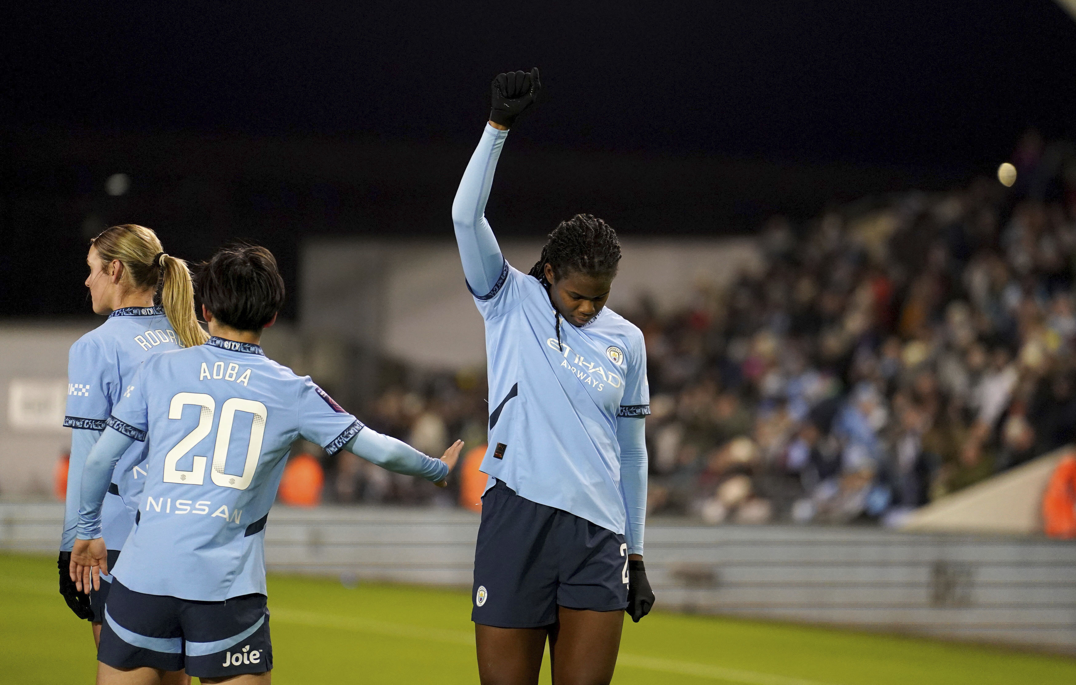 Manchester City's Khadija Shaw gestures as she celebrates scoring their side's second goal during the English women's Super League match between Manchester City and Liverpool, at the Manchester City Joie Stadium, Manchester, England, Sunday, Feb. 16, 2025.