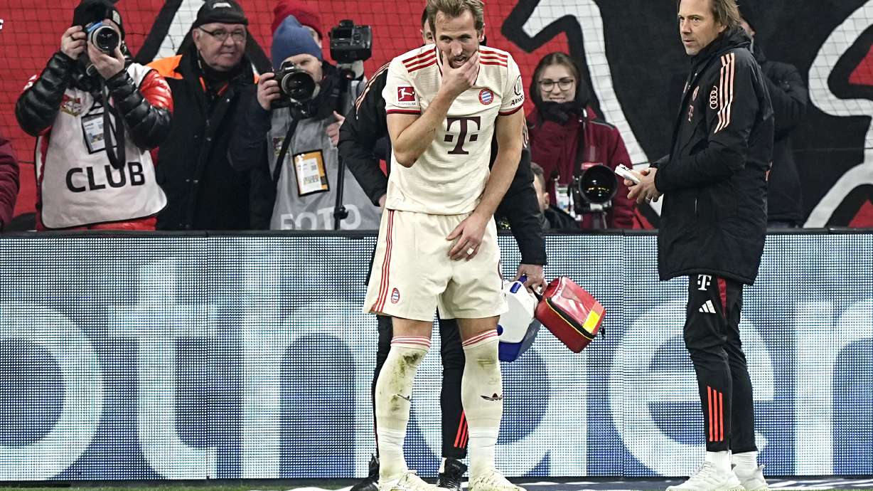 Bayern's Harry Kane reacts injured during the German Bundesliga soccer match between Bayer Leverkusen and FC Bayern Munich at the BayArena in Leverkusen, Germany, Saturday, Feb. 15, 2025.