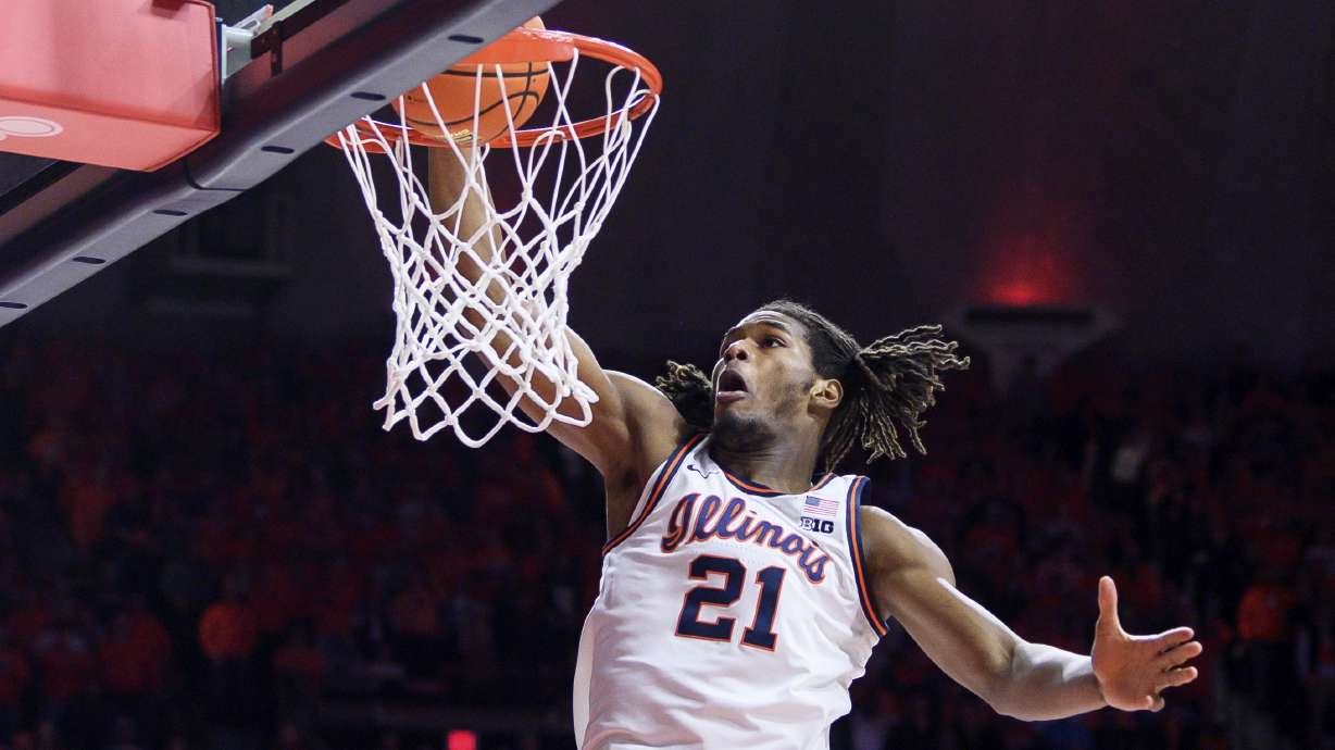 Illinois' Morez Johnson Jr. dunks during the first half of an NCAA college basketball game against Michigan State, Saturday, Feb. 15, 2025, in Champaign, Ill.